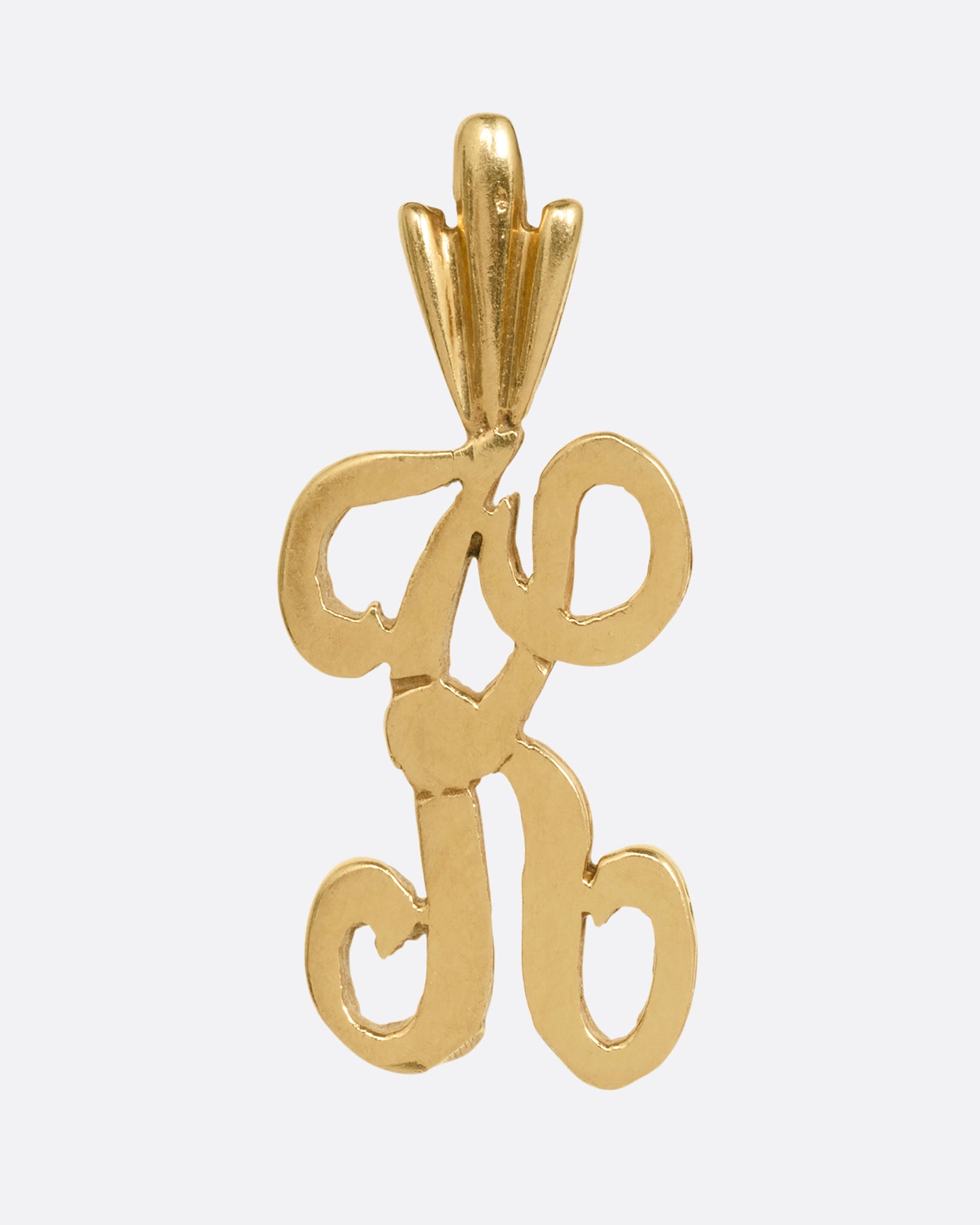 A curling initial 'K' charm, shown from the front.