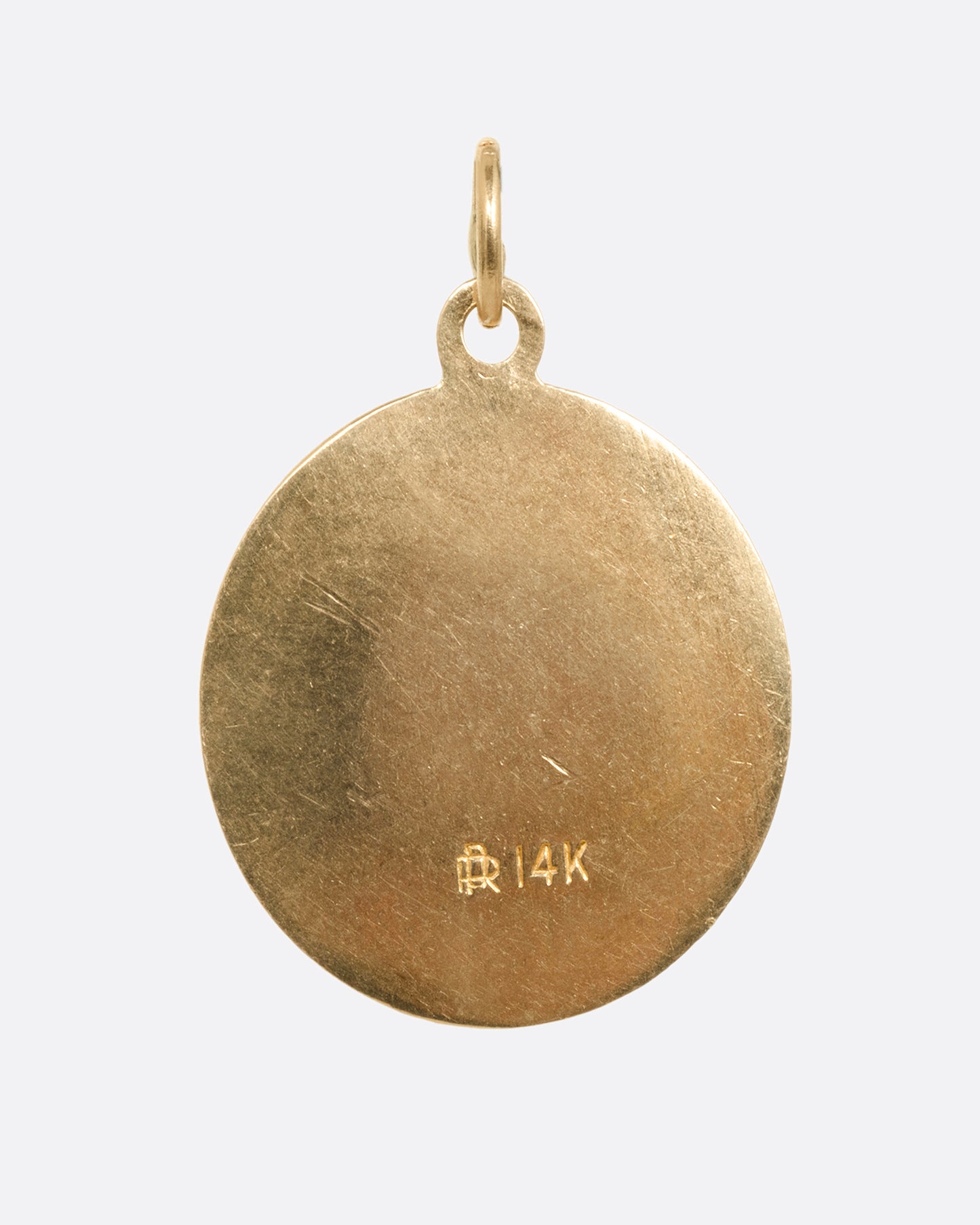 A round yellow gold Saint Christopher pendant, shown from the back.