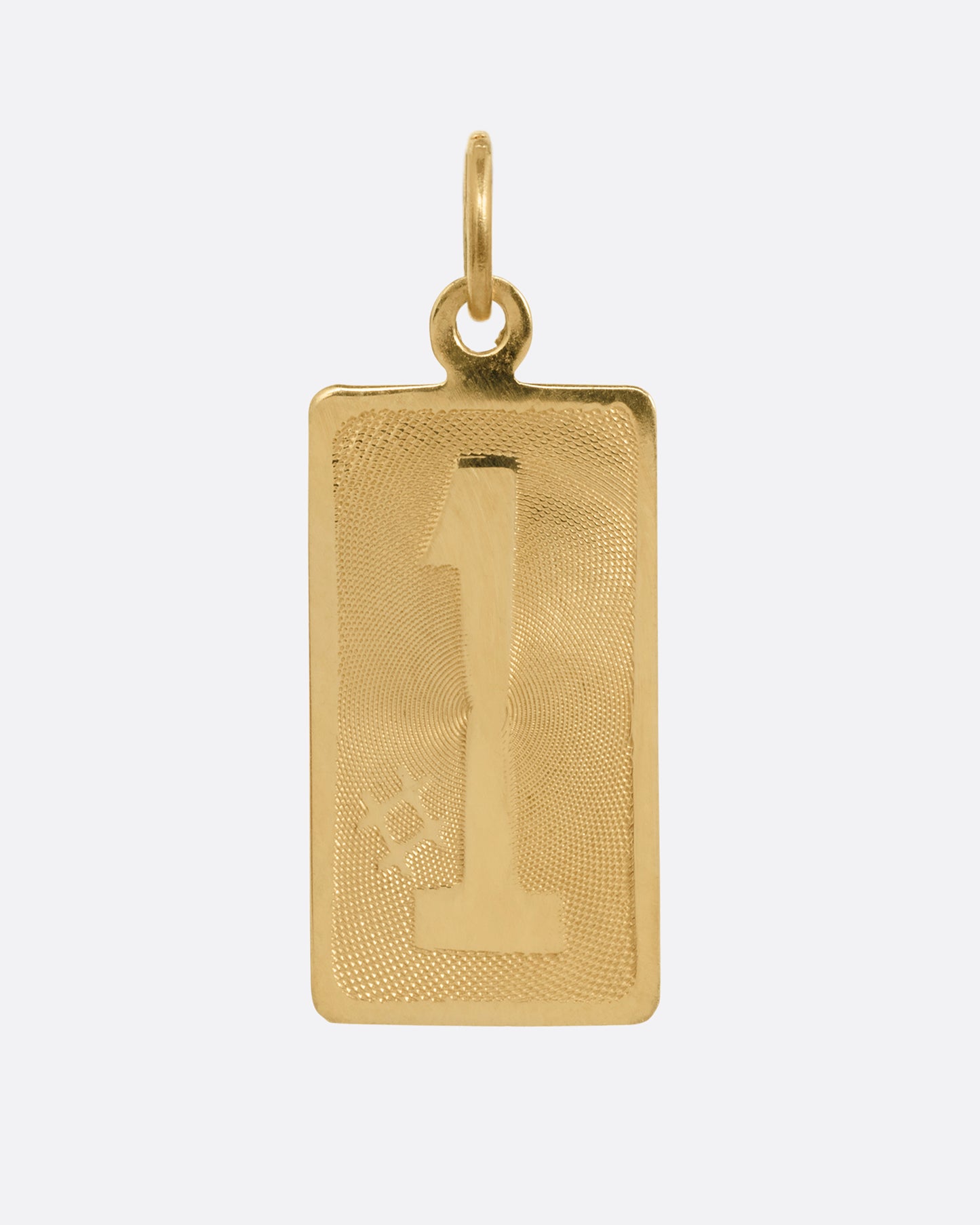 A yellow gold rectangular #1 vintage charm. Shown from the front.