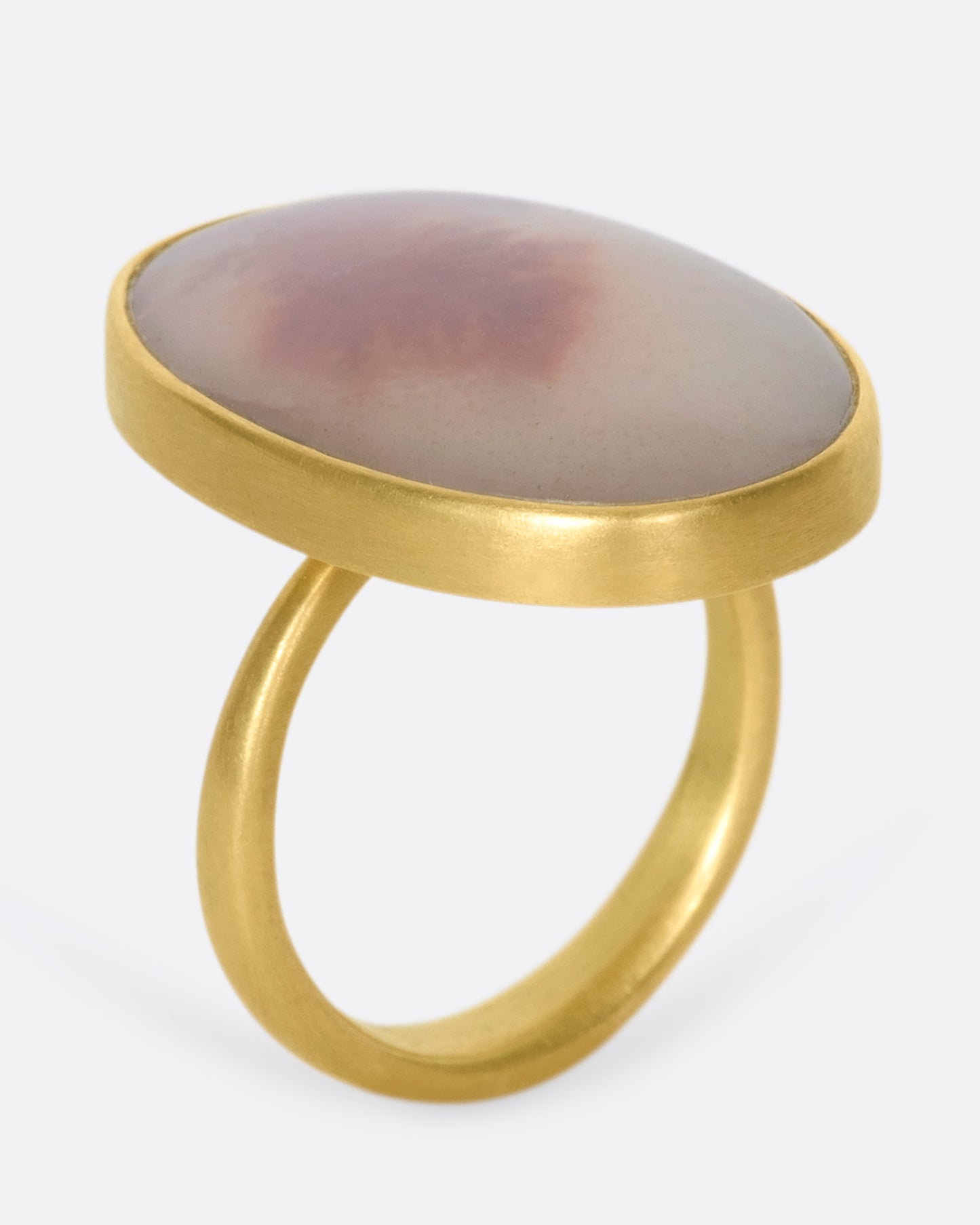 A 14k gold oval dendritic agate quartz ring. The band is perfectly weighted, so the quartz never falls to the side