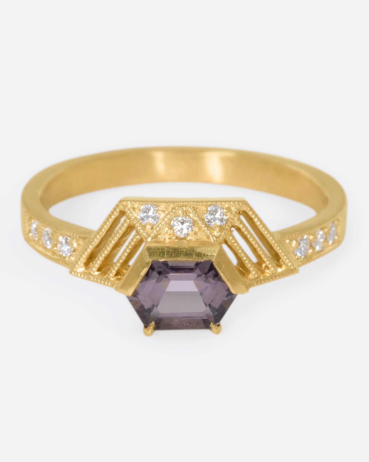 This one-of-a-kind lavender spinel ring dazzles on its own, or in a stack with other DMD Metal rings. The hexagonal half-halo feels like a modern twist on art deco design.