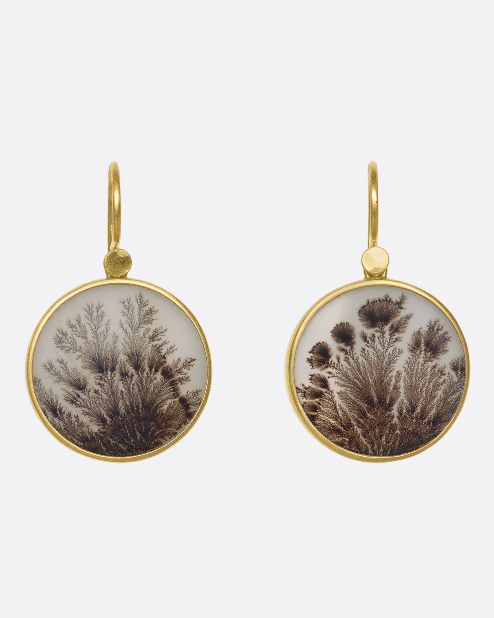 A pair of yellow gold, bezel set, round dendritic agate earrings.