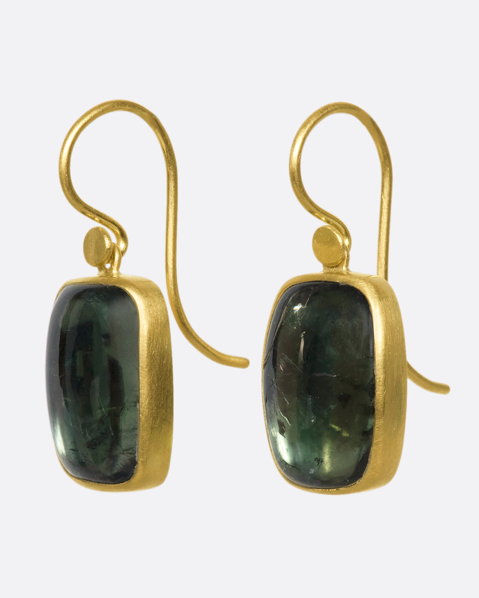 18k gold drops with green tourmaline chiclets. A gold bezel wraps the translucsent forrest green stone with stunning contrast that makes the tourmaline truly pop.