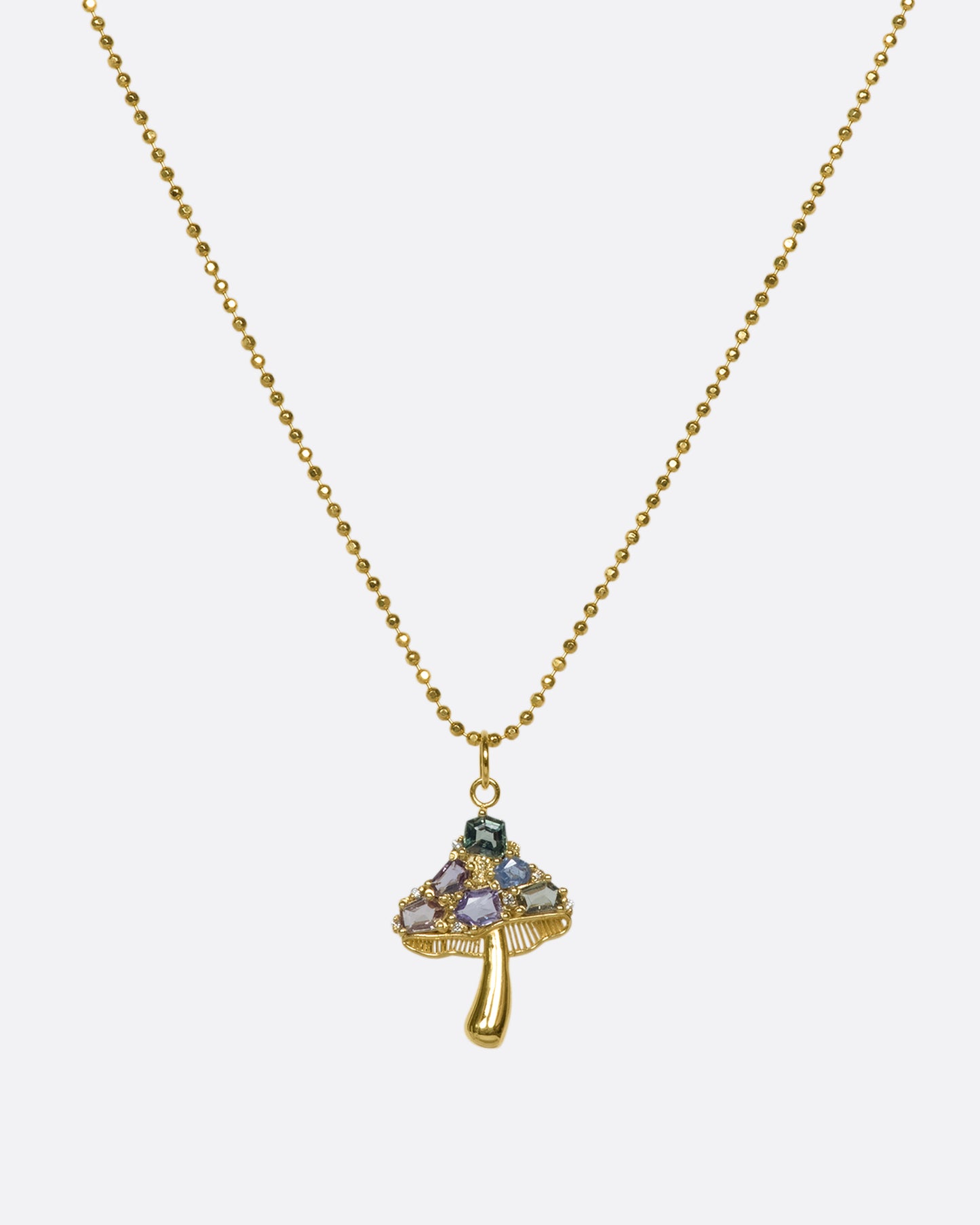 A faceted cut ball chain that refracts light, creating a sparkly look, with a 14K gold mushroom pendant