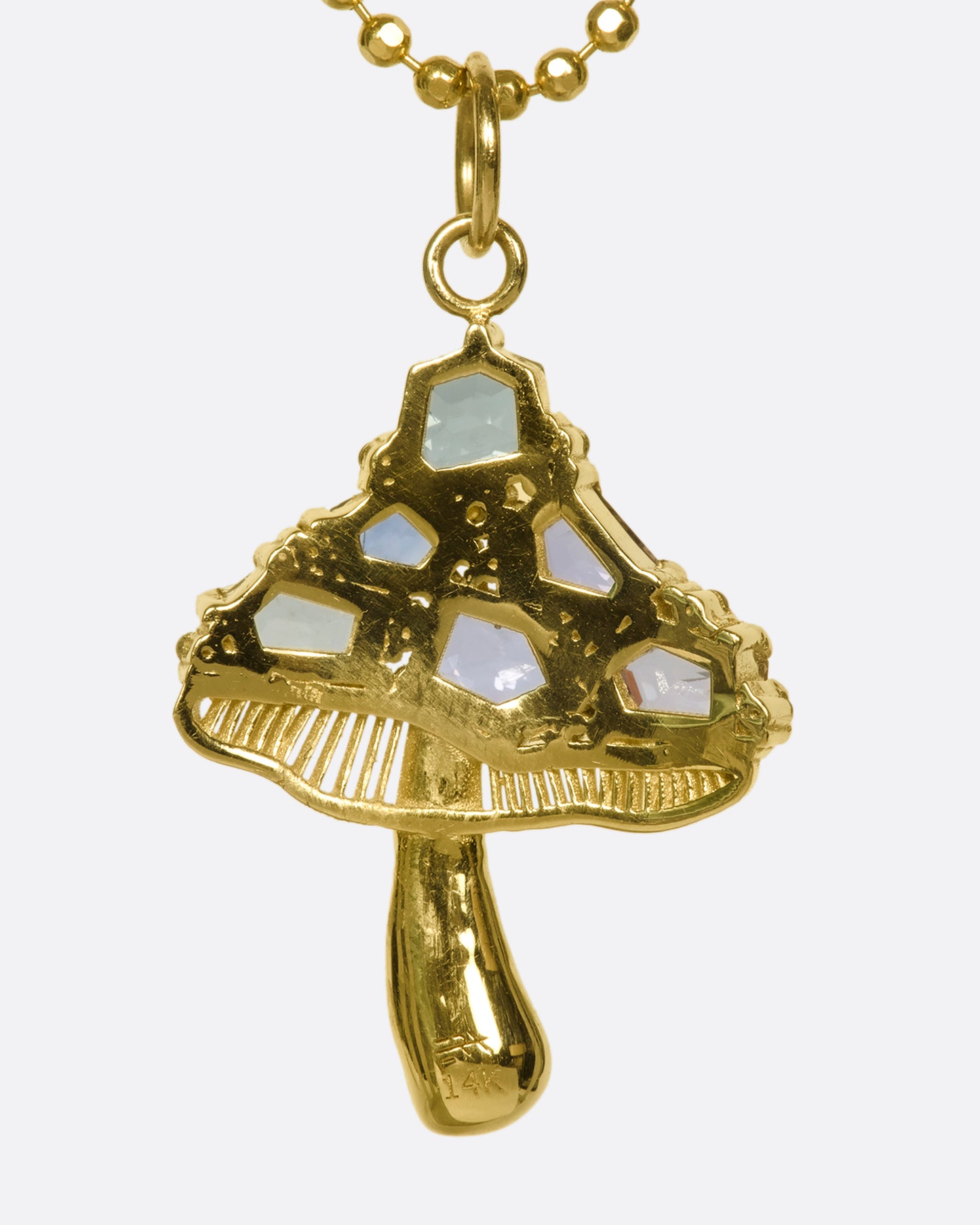 A faceted cut ball chain that refracts light, creating a sparkly look, with a 14K gold mushroom pendant