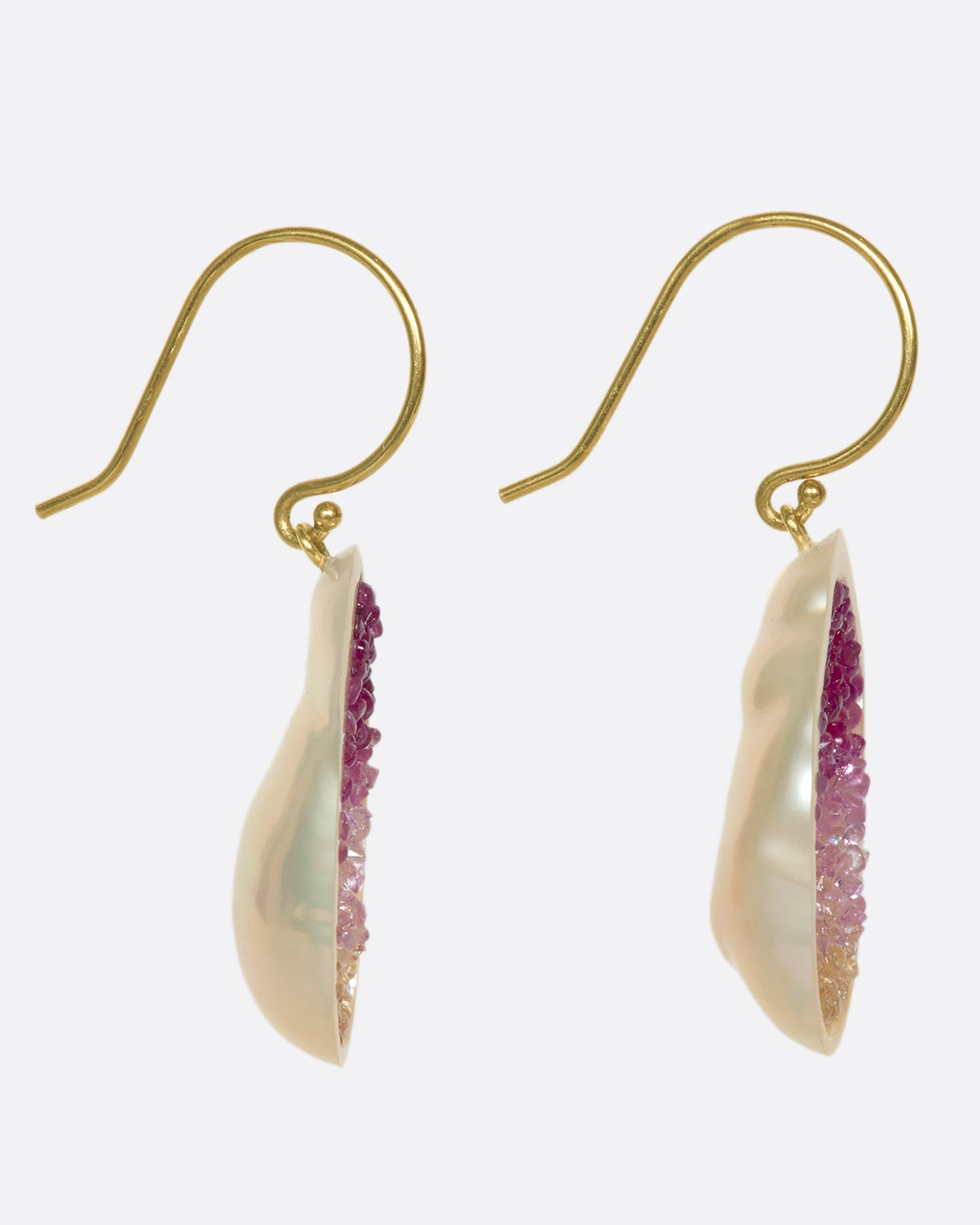 The smooth, soft pearls are lined with reclaimed pink and yellow ombre sapphires