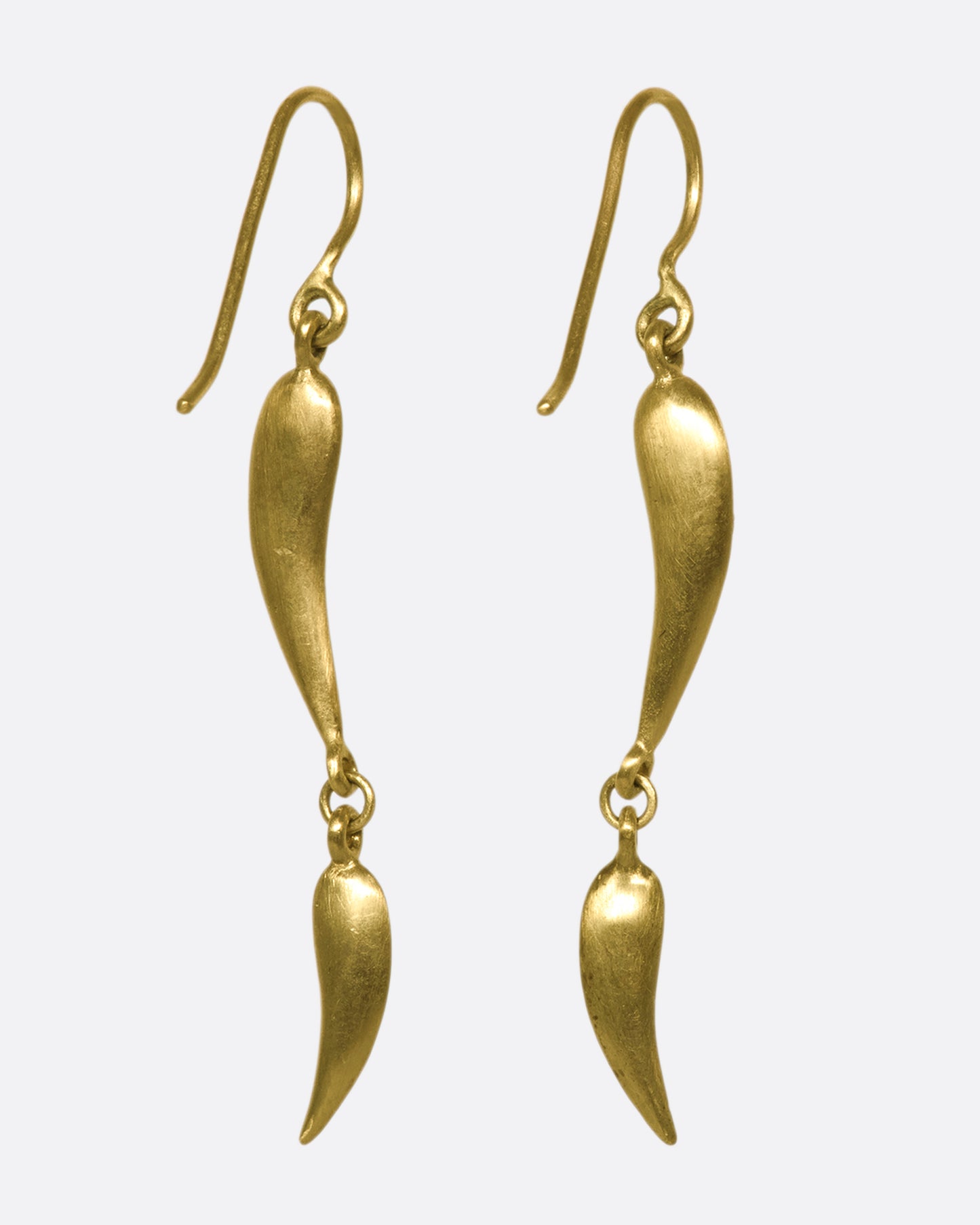 The back of a gold drop earrings with 2 curved segments on each side, two of which have 5 diamonds.