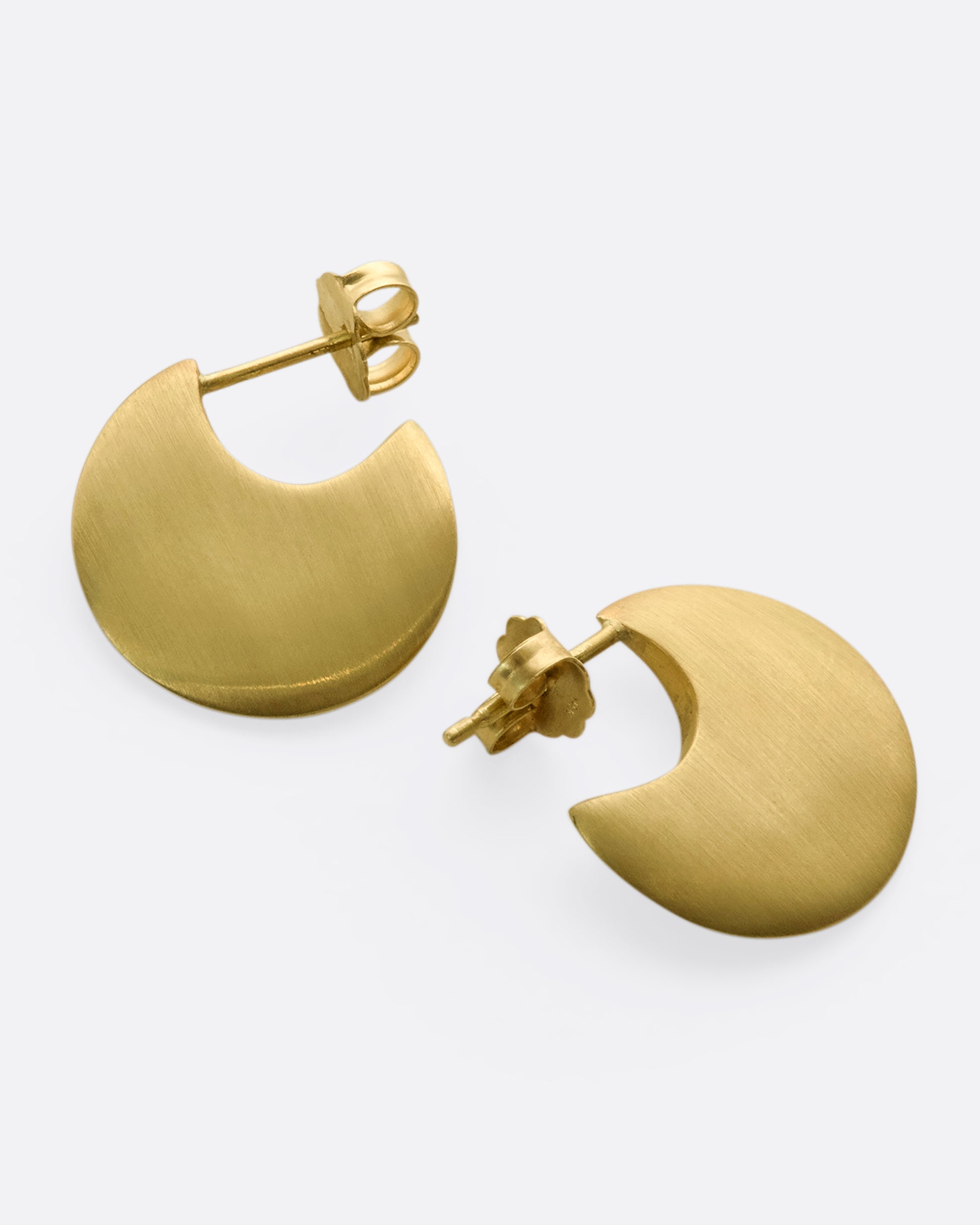 From the front, this pair of 10K solid gold hoop earrings look razor thin.