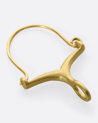 The back of a gold and diamond charm holder.