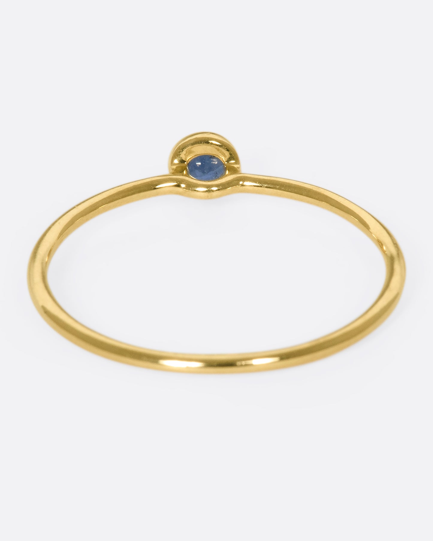 Round blue sapphire set on a 9k gold ring