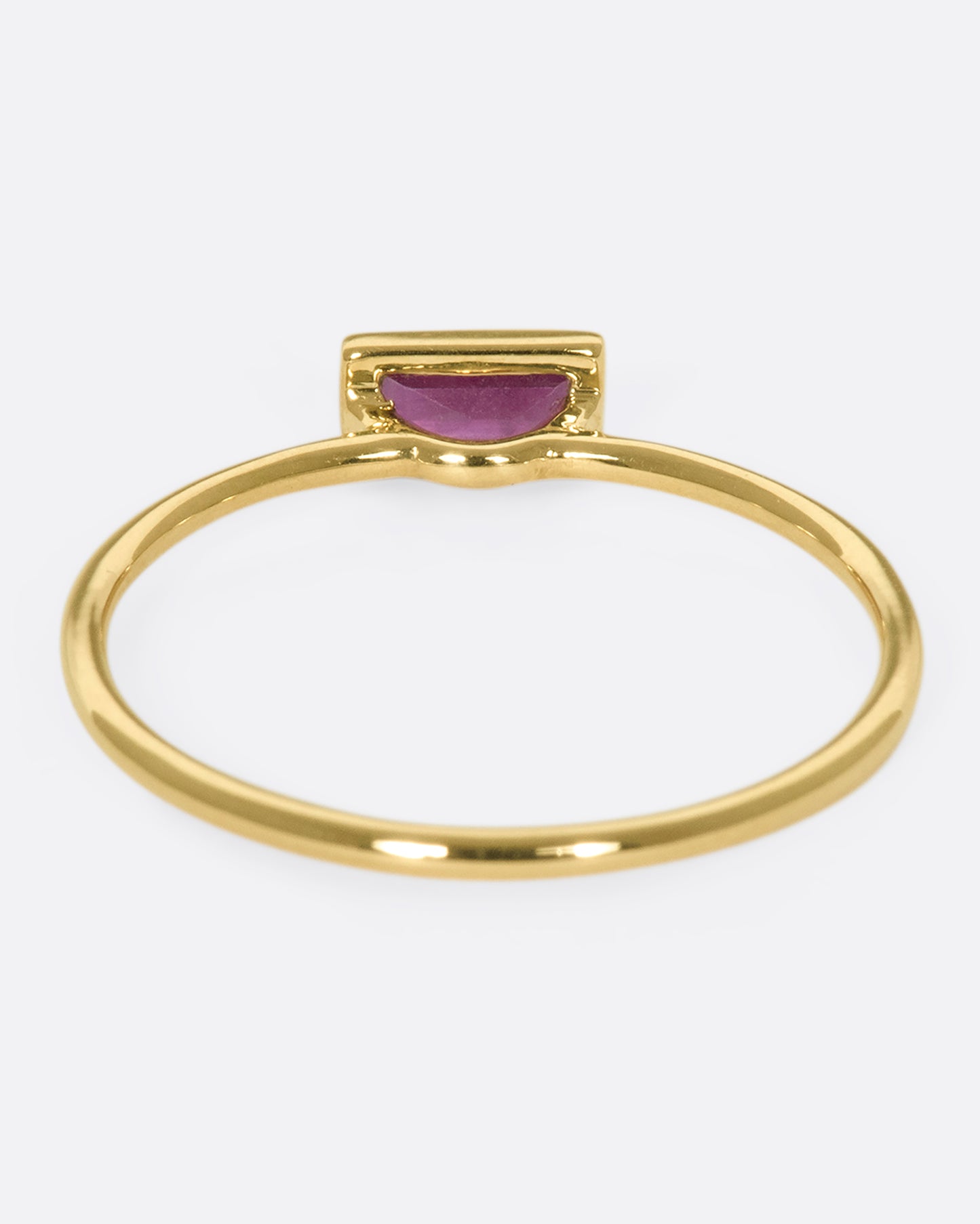 This horizontal ruby baguette set in 9k gold is a stunning stacker, adding color, sparkle, and dimensional interest without bringing any bulk.