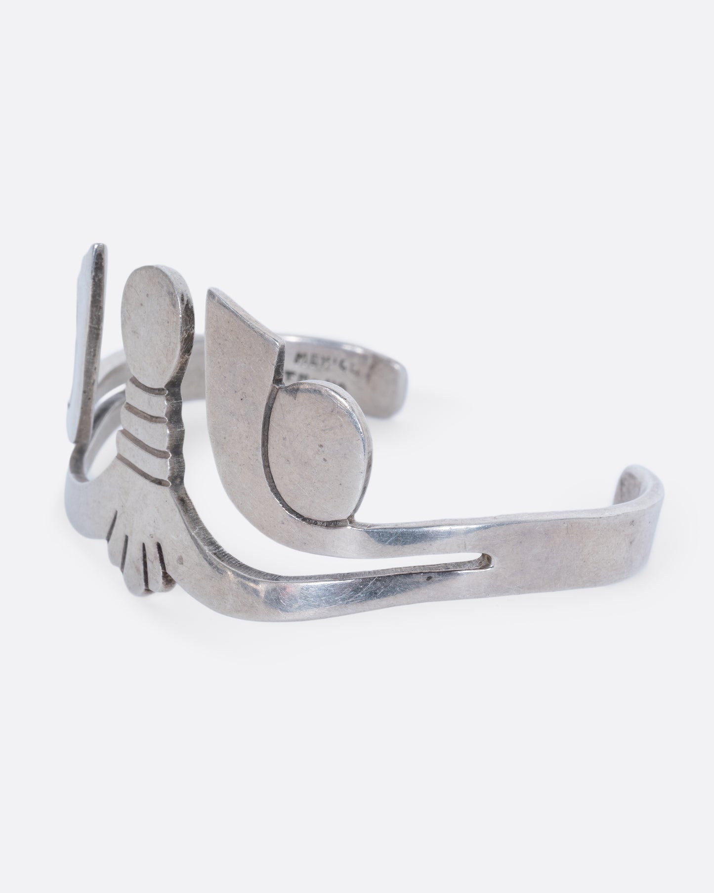 A sterling silver cuff with Egyptian motif. View from the side.