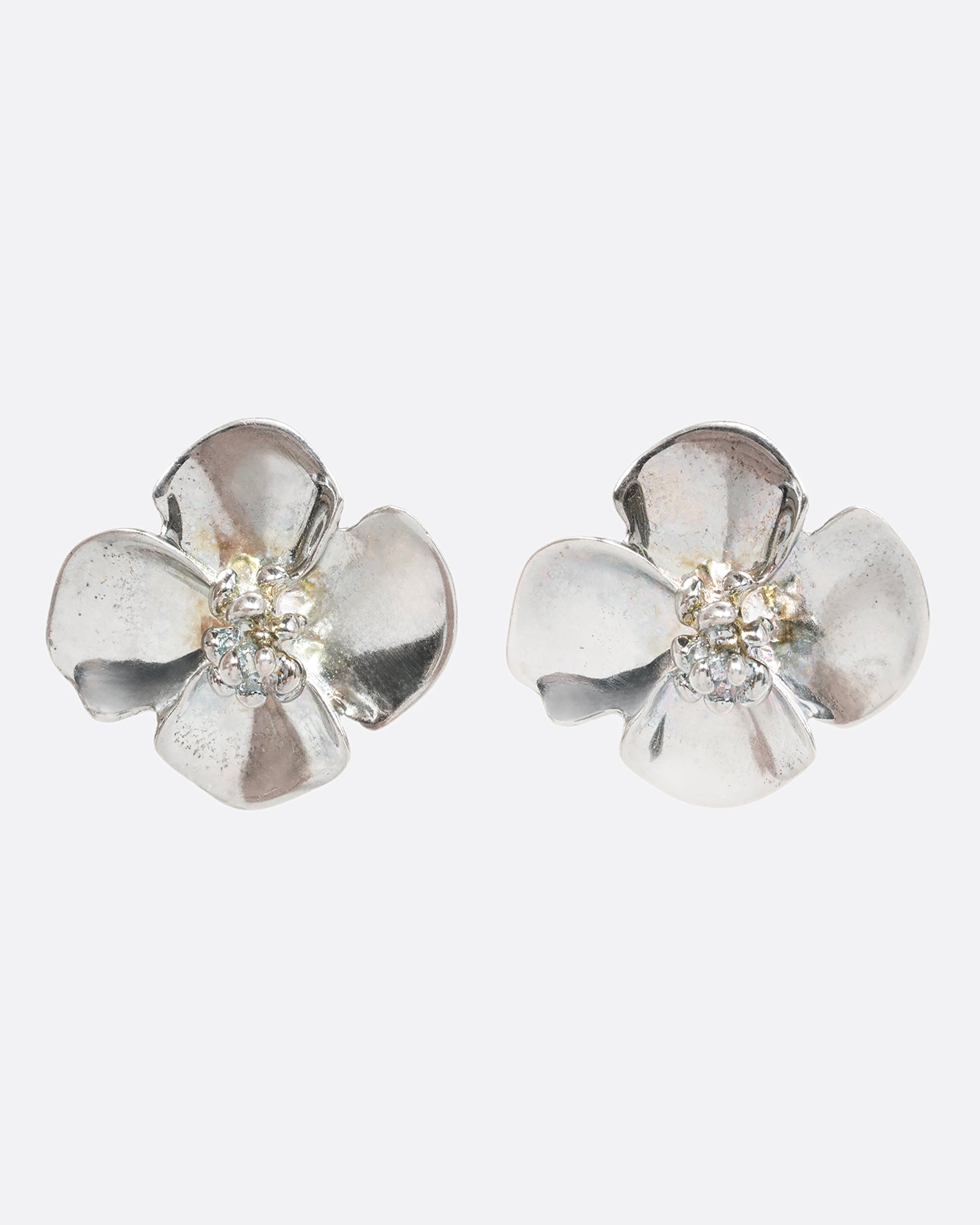 Sterling silver 3D flower clip on earrings. View from the front.