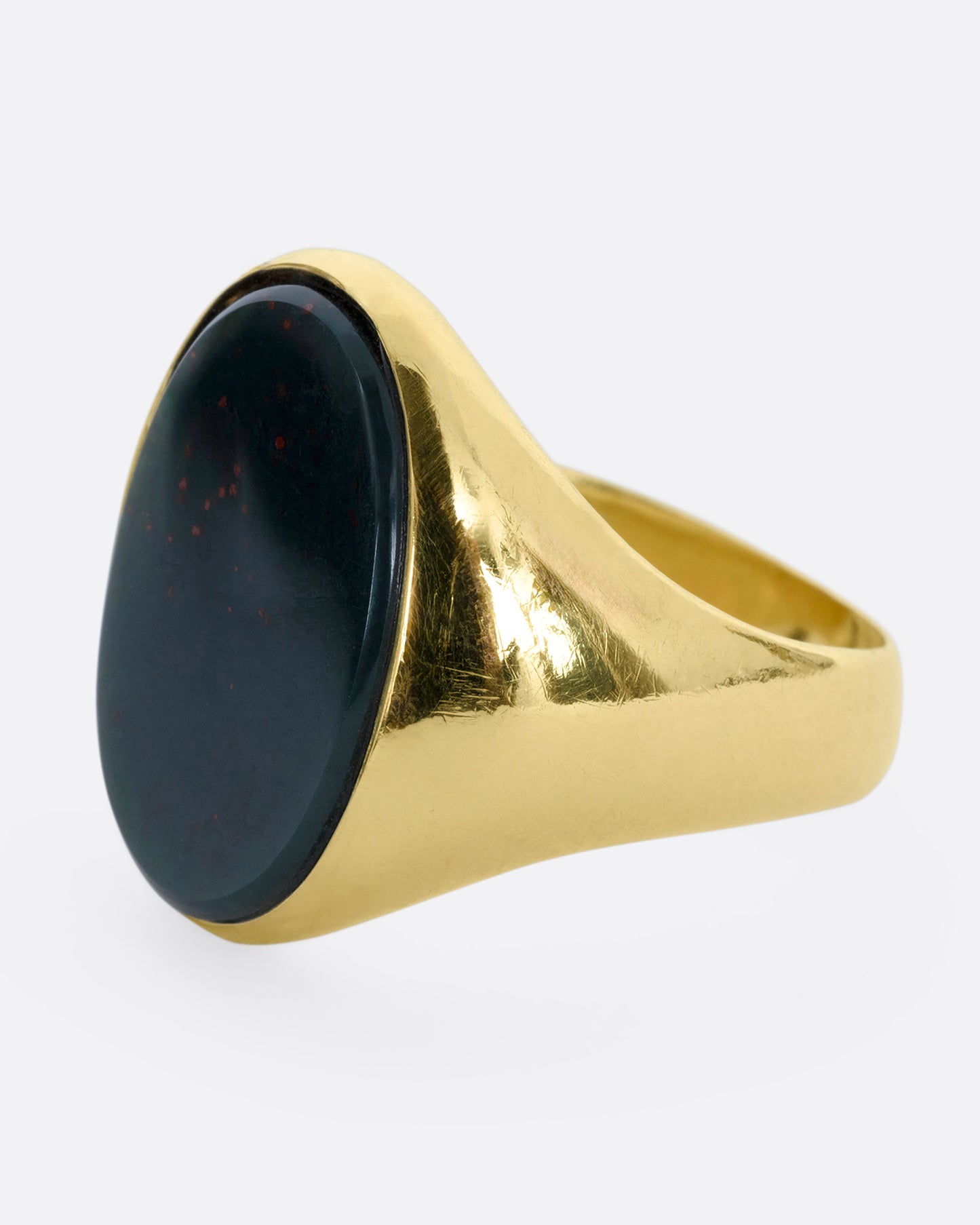 A yellow gold bloodstone signet ring. View from the side.