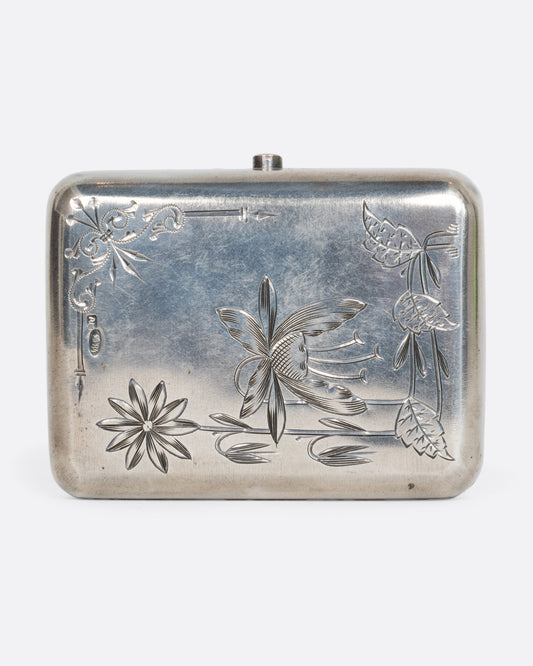 A rectangular silver case with floral etching shown from the front.