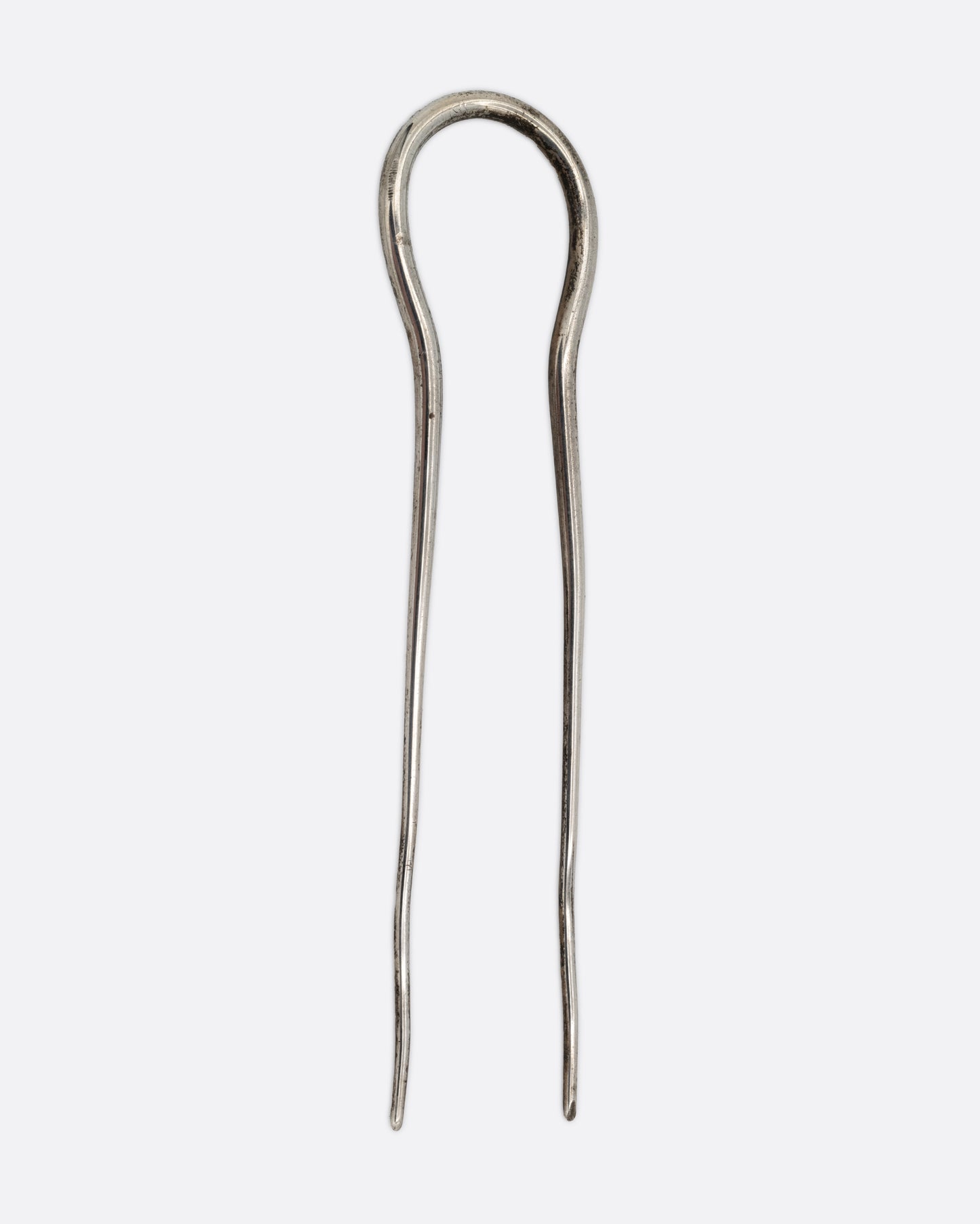 A silver hair pin with an arch at the top, shown from the front.