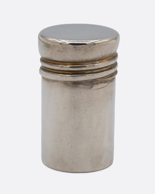 A small silver screw top canister, shown from the front.