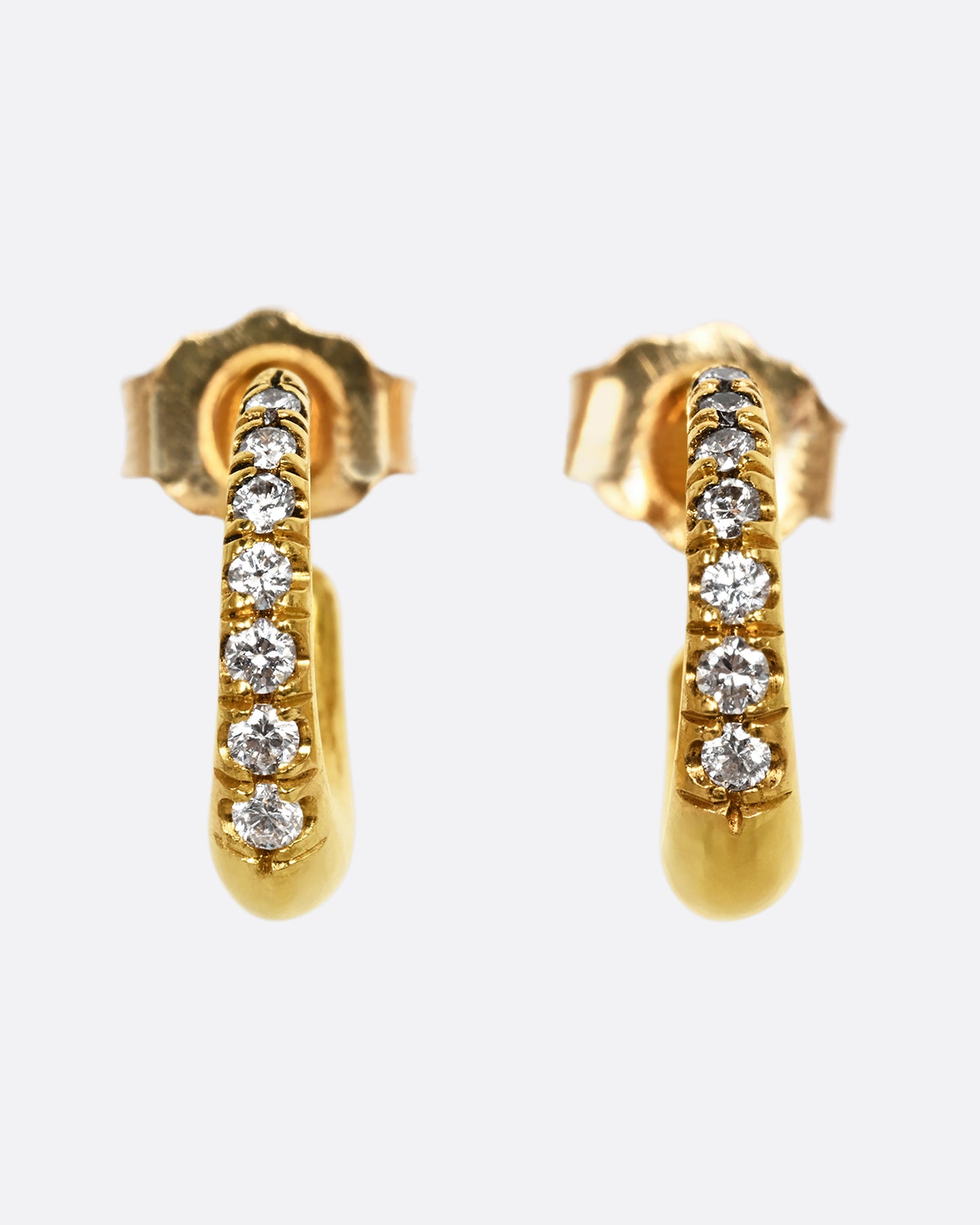 A yellow gold earring with graduated diamonds. Shown from the front as a pair.