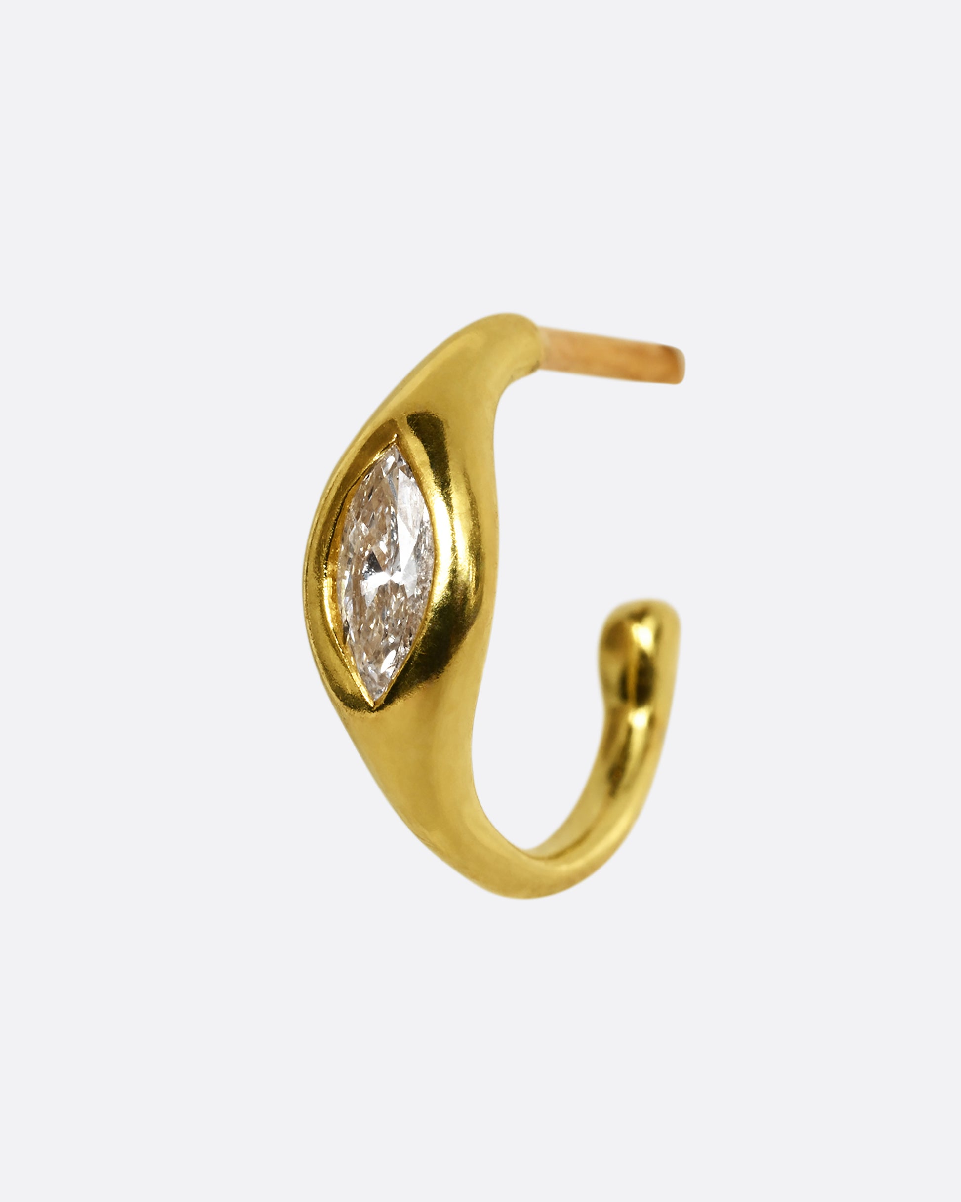 A yellow gold hoop earring with a marquis diamond, shown from the side.