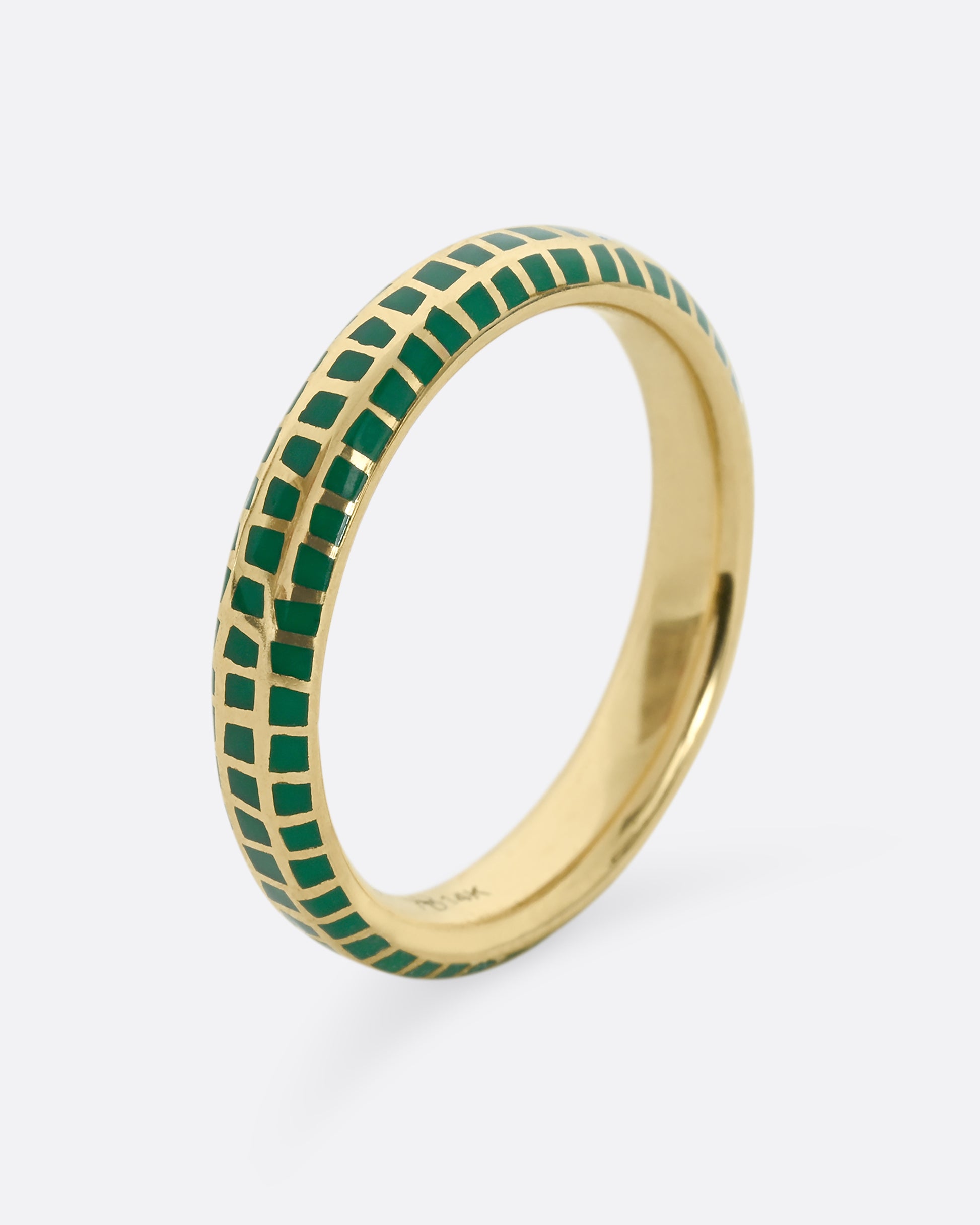 A yellow gold band with an irregular checkered pattern all the way around. Shown from the side, standing up.