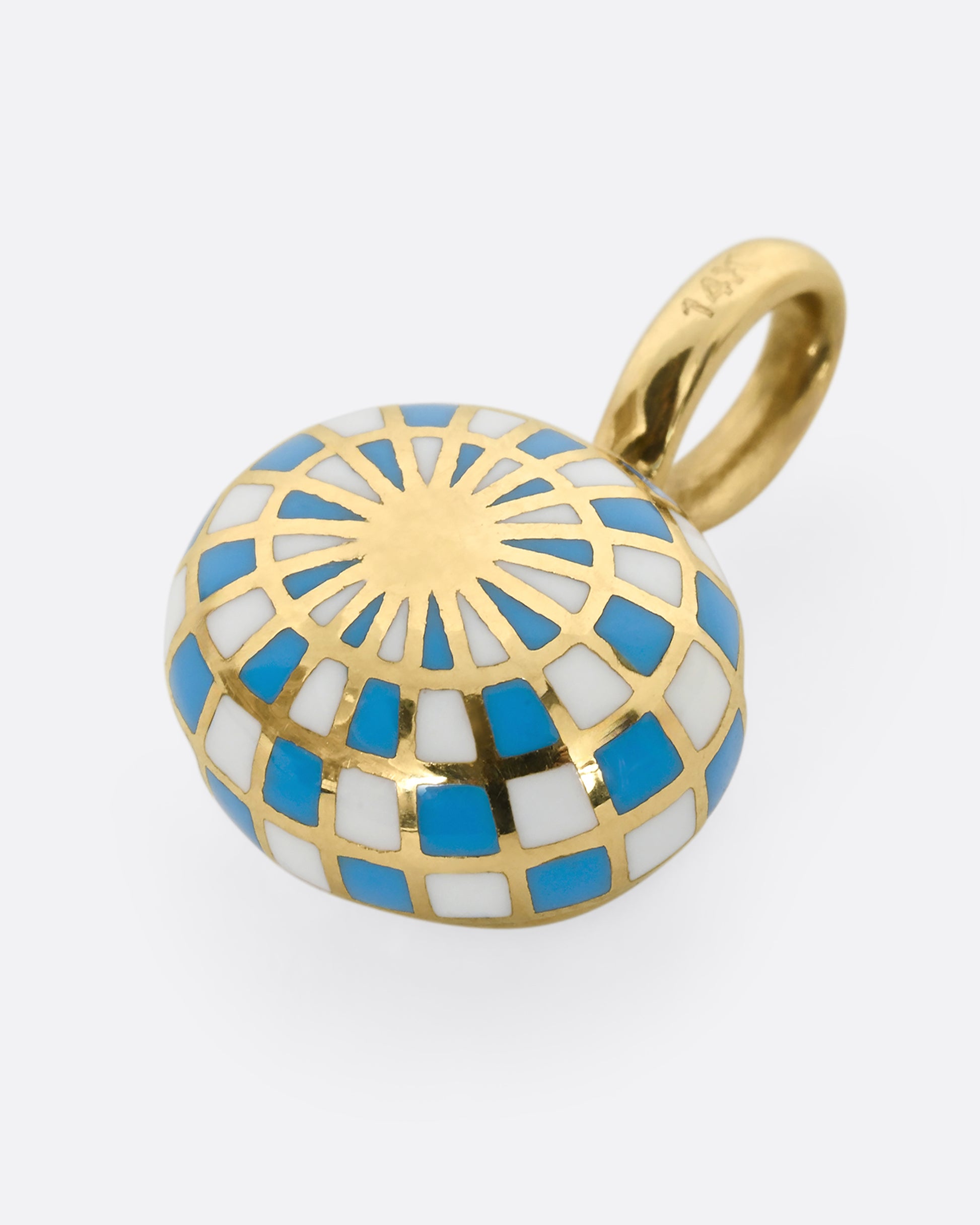 A yellow gold oval pendant with blue and white enamel surrounding an emerald. Shown hanging from the back.