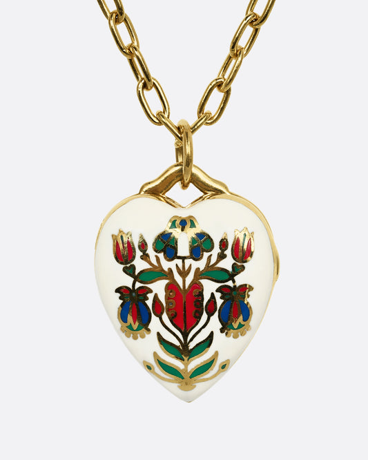 A yellow gold heart shaped locket with a multicolor floral motif on a heavy chain. Shown from the front.