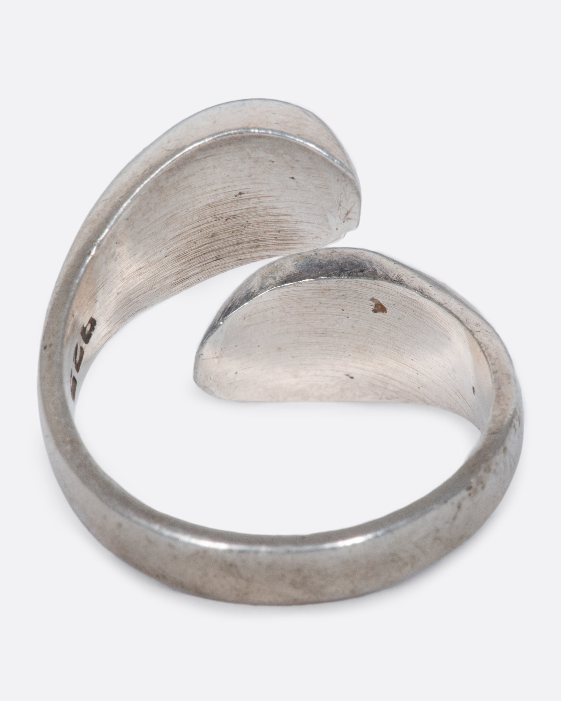 A vintage sterling silver wrap ring with rounded ends.