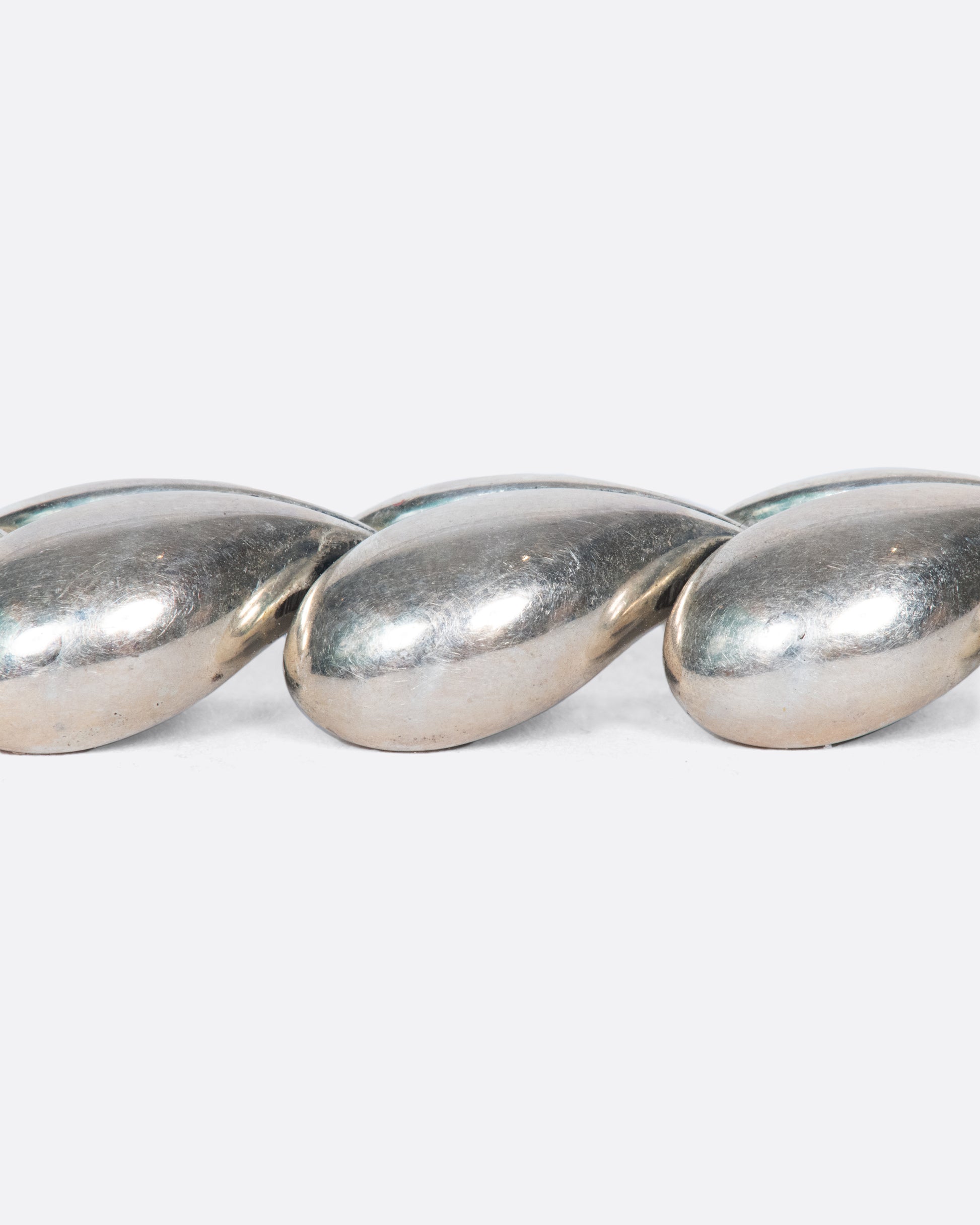This vintage Thai sterling silver bracelet is made entirely of sweet, puffy hearts.