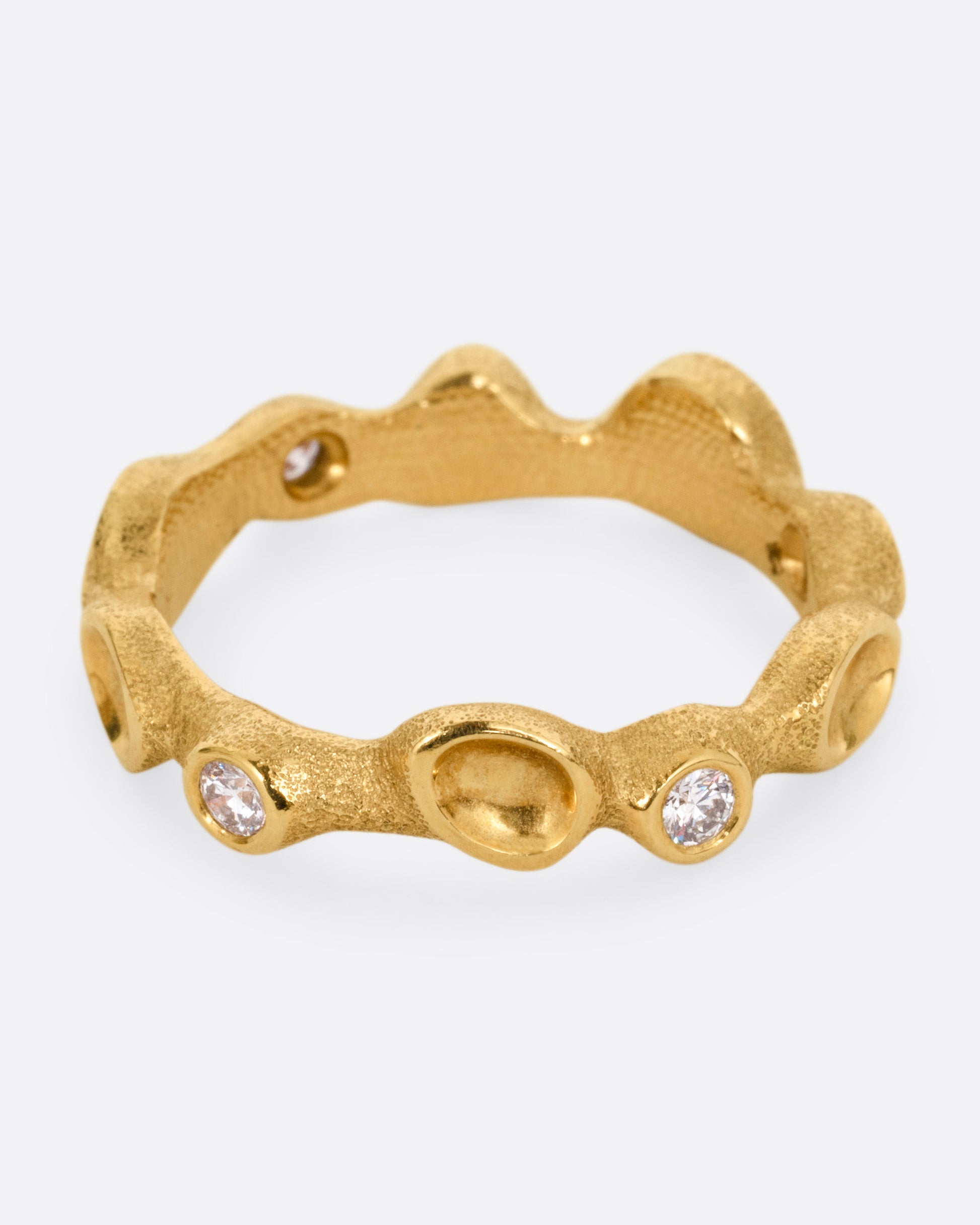 A yellow gold ring resembling a coral reef, with white diamonds, shown from the front.