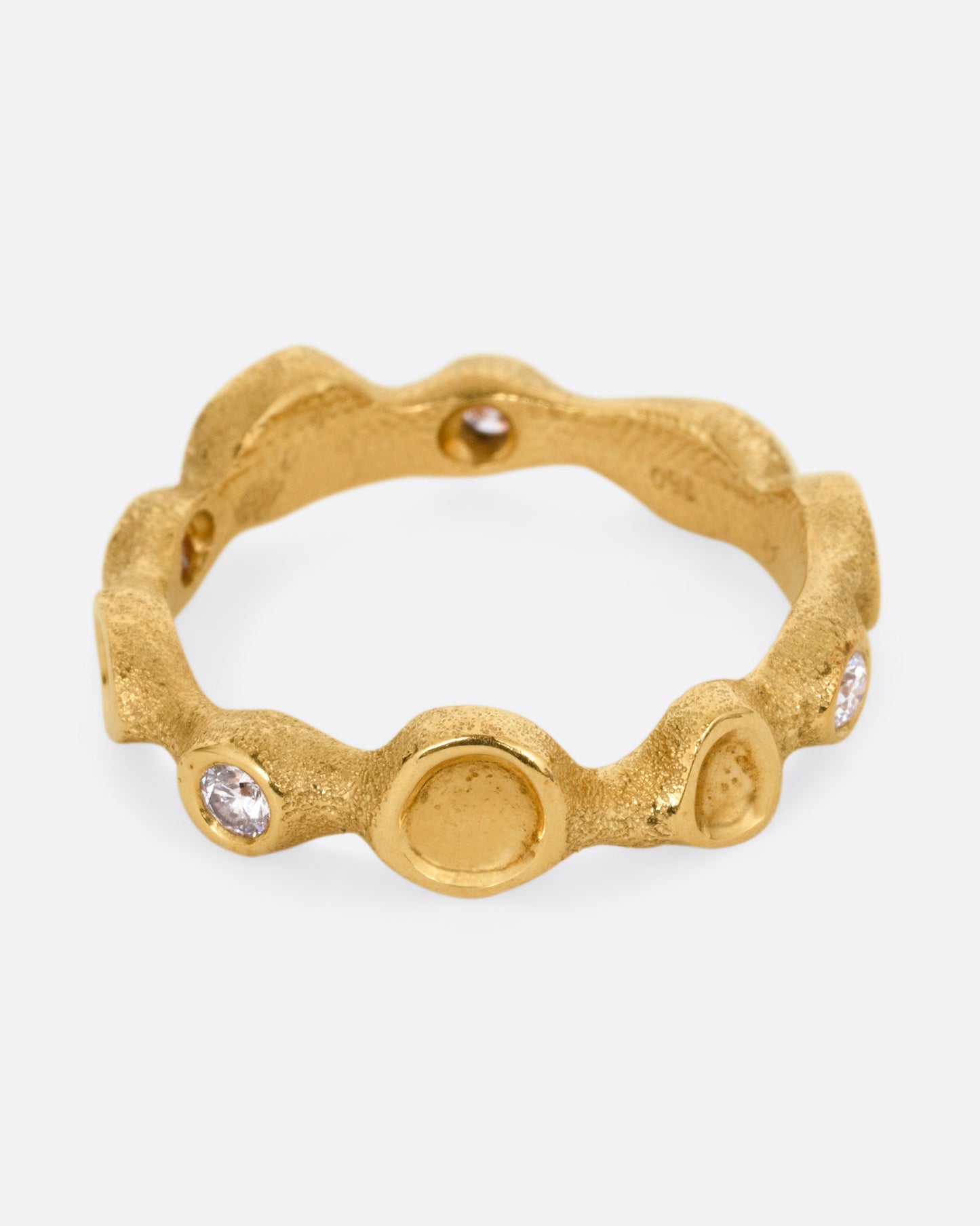 A yellow gold ring resembling a coral reef, with white diamonds, shown from the front.