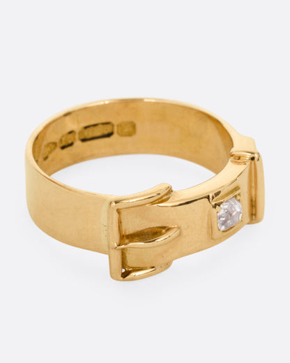 A yellow gold Victorian remembrance buckle ring with an old mine cut diamond. Shown from the front.