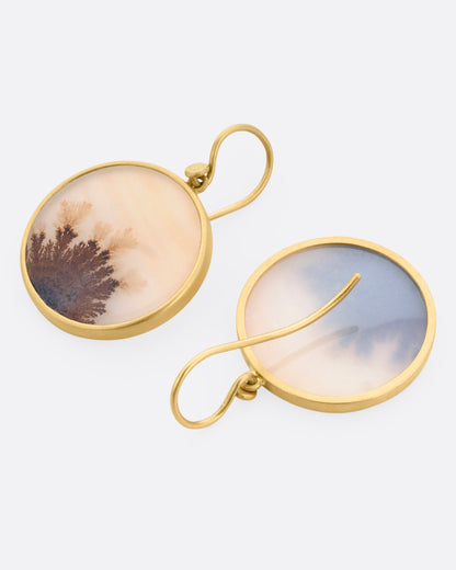 Yellow gold dendritic agate circle drop earrings, the pair laid flat, one from the front and one from the back