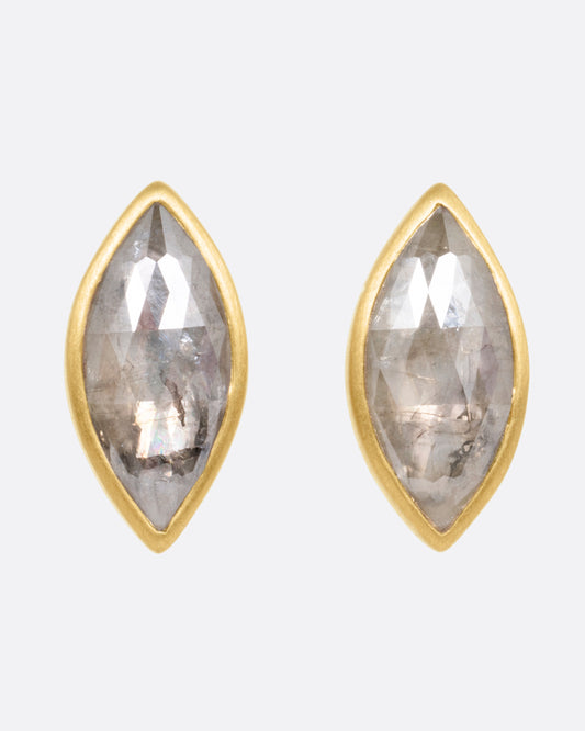 A pair of yellow gold navette diamond earrings, shown from the front.