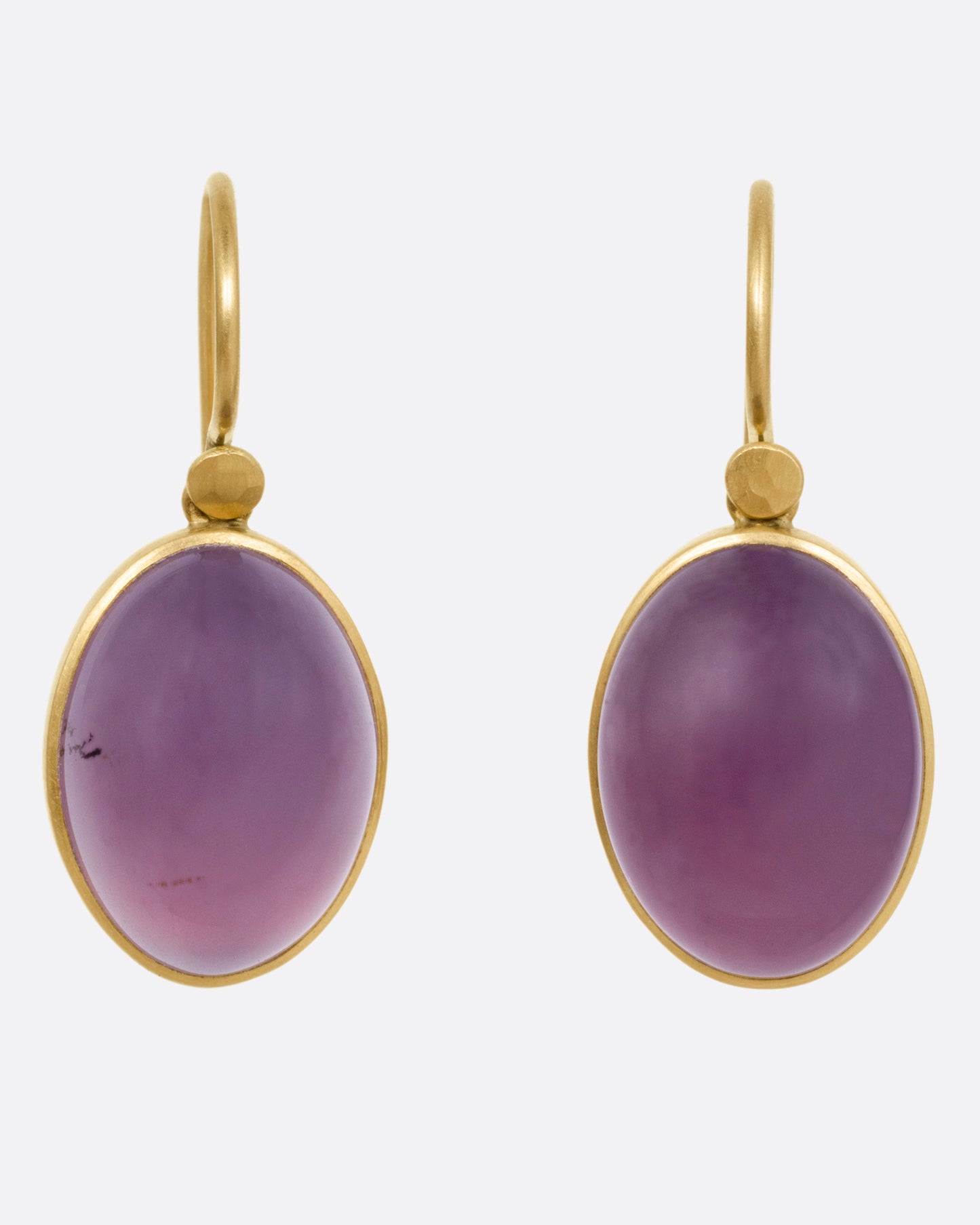 A pair of yellow gold earrings with purple chalcedony drops, shown from the front.