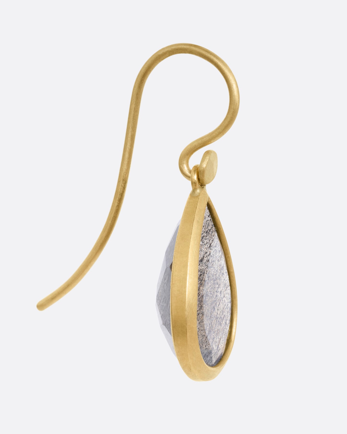 A yellow gold earring with a labradorite teardrop, shown from the side.