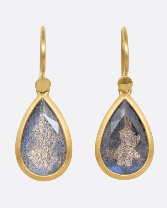 A pair of yellow gold earrings with labradorite teardrops, shown from the front.