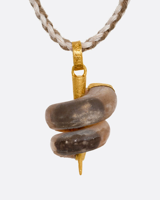 A high karat yellow gold necklace with an agate twist on a cord. Shown from the front.