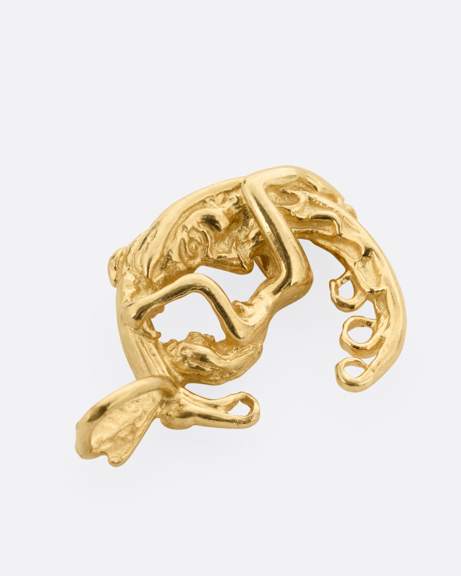 A yellow gold pendant with a woman astride a crescent moon. Shown from the front lying flat.