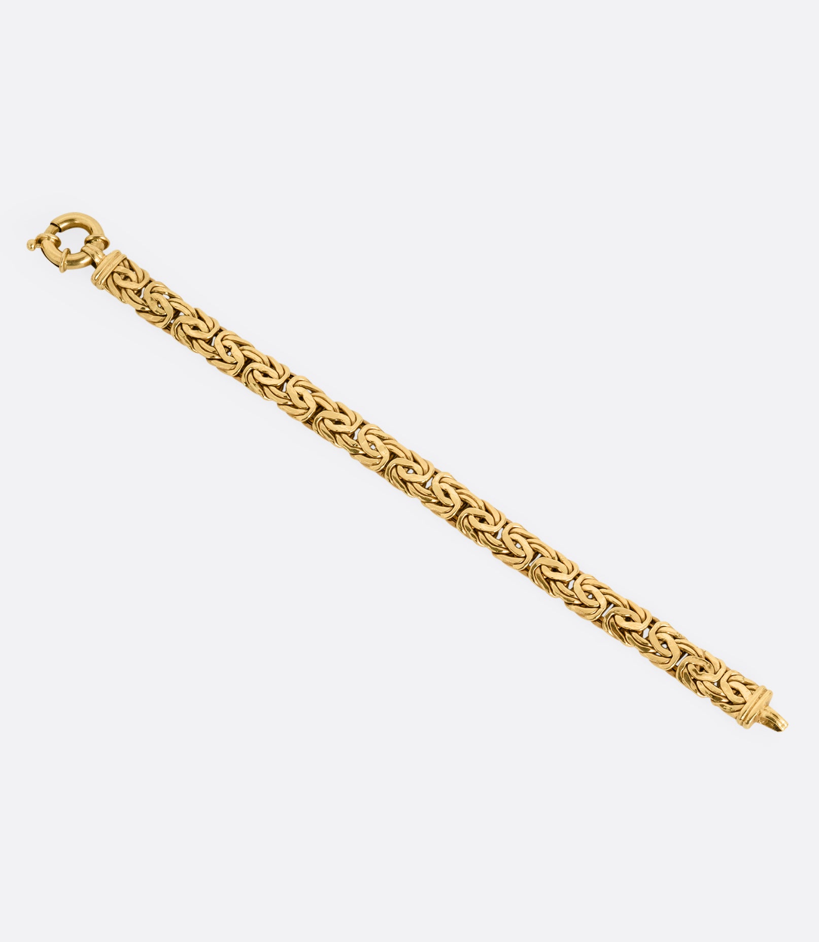 A yellow gold byzantine chain bracelet, shown from the front.