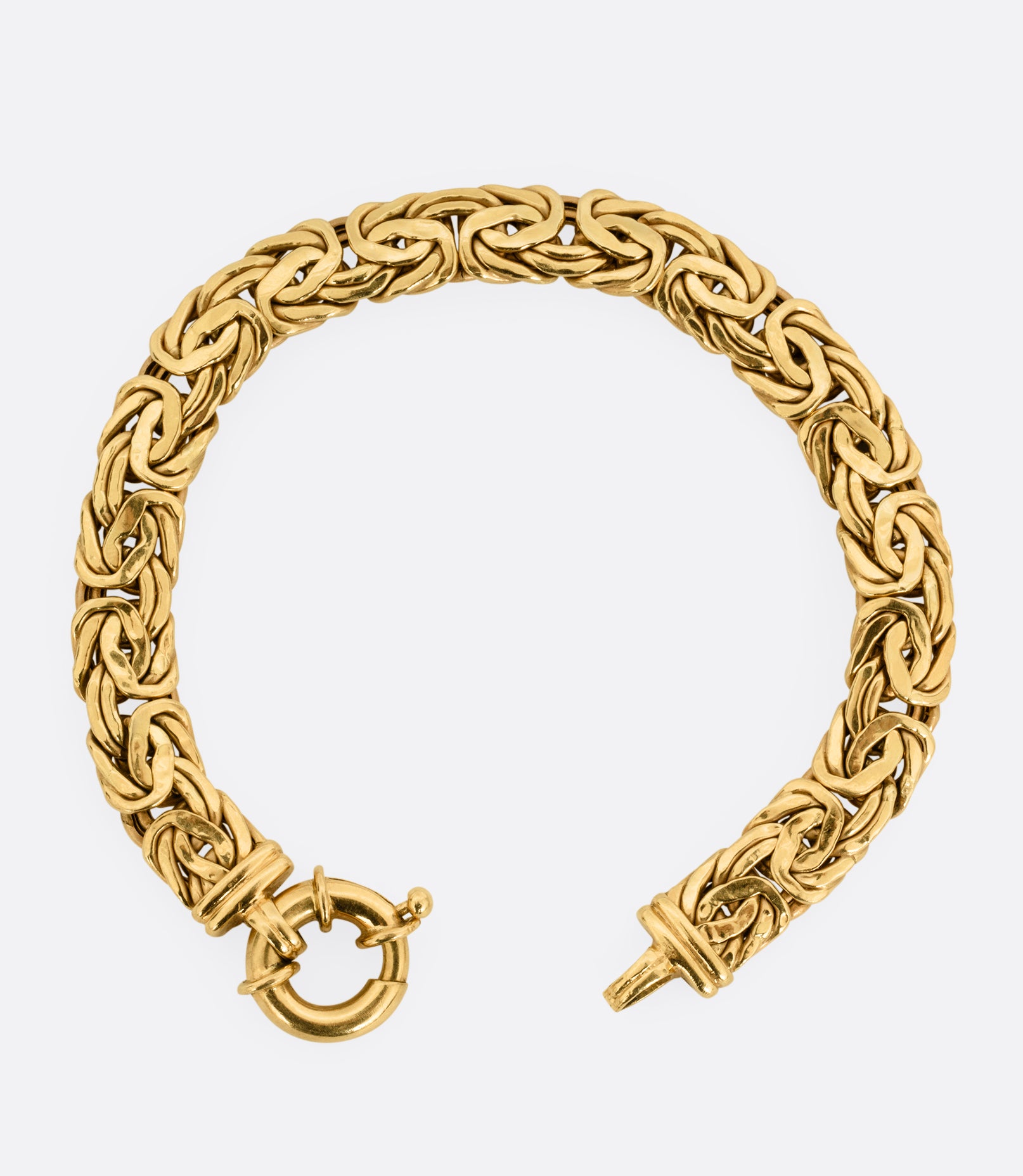 A yellow gold byzantine chain bracelet, shown from the front.