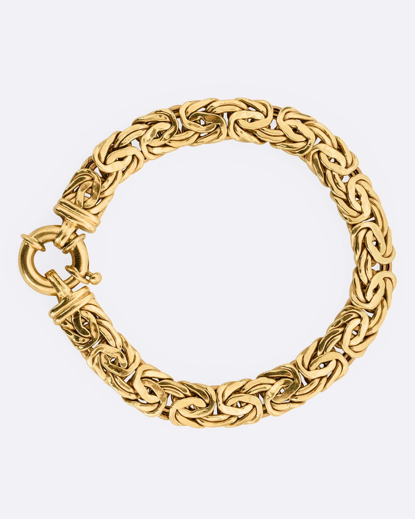 A yellow gold byzantine chain bracelet, shown from the front.