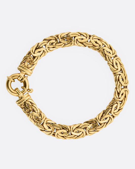 A yellow gold byzantine chain bracelet, shown from the front.