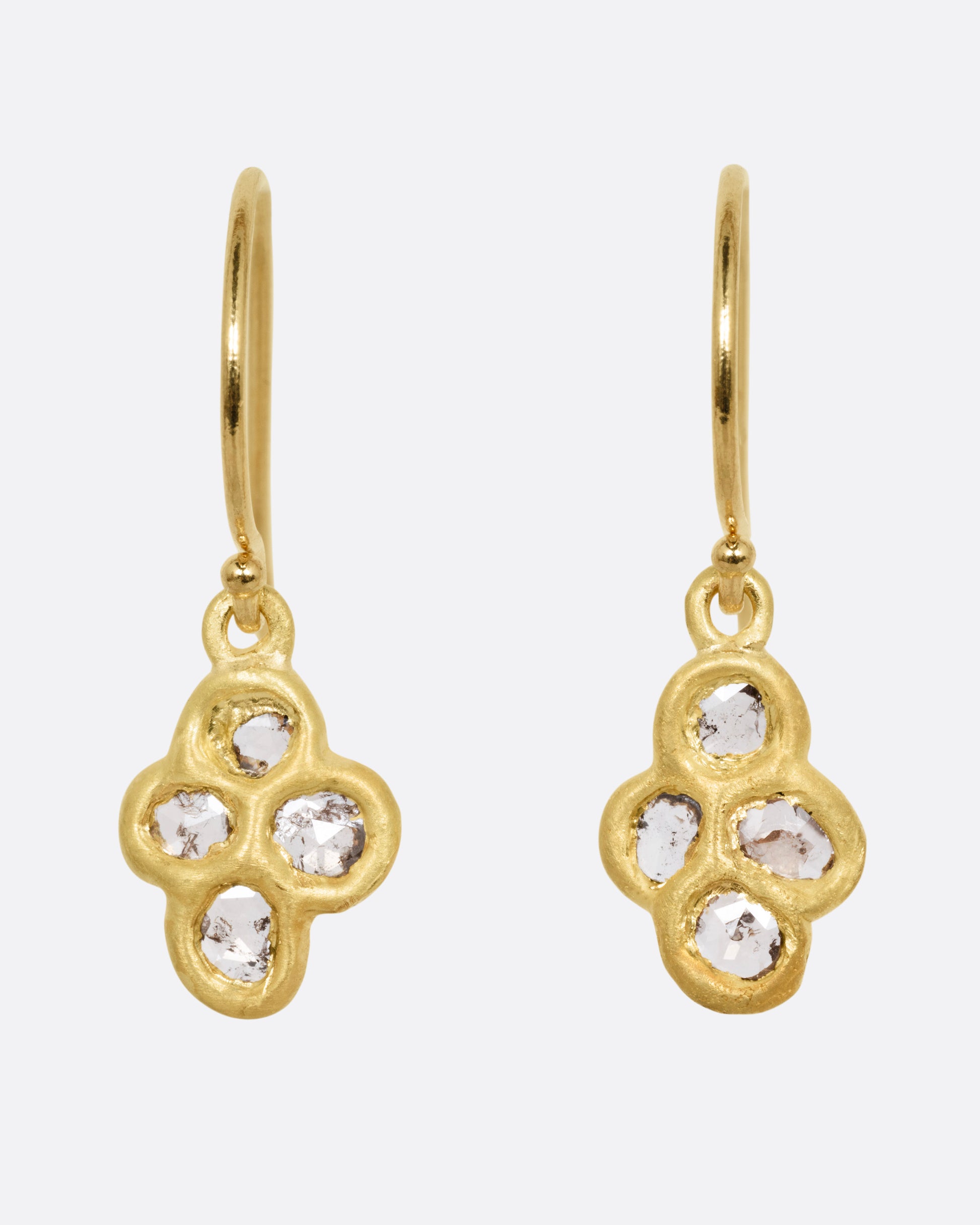 A pair of yellow gold drop earrings with four rose cut diamonds, shown from the front.