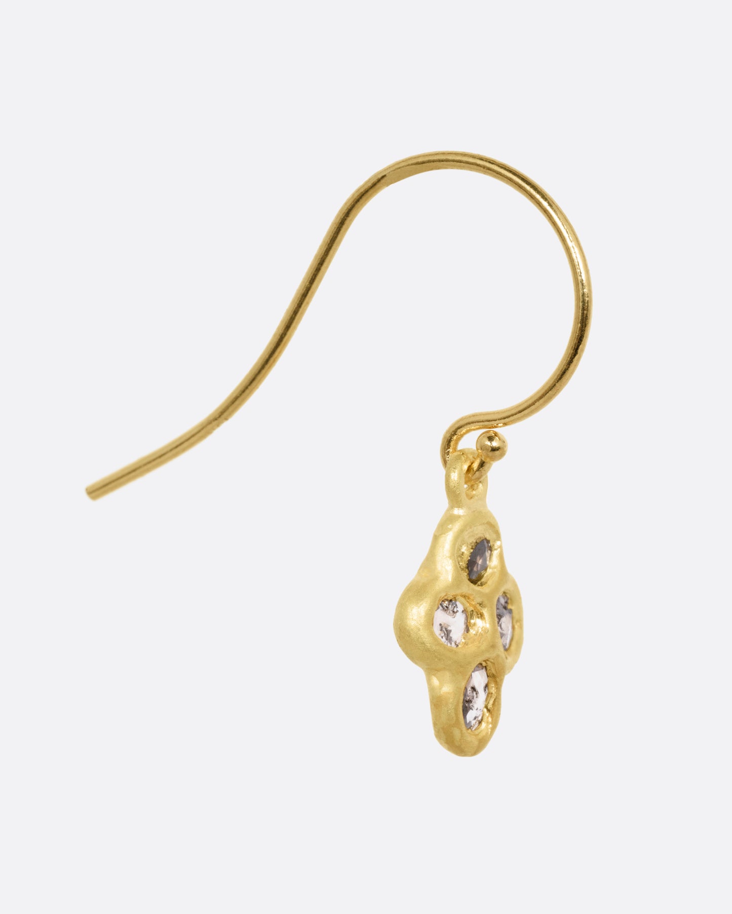 A yellow gold drop earring with four rose cut diamonds, shown from the side.