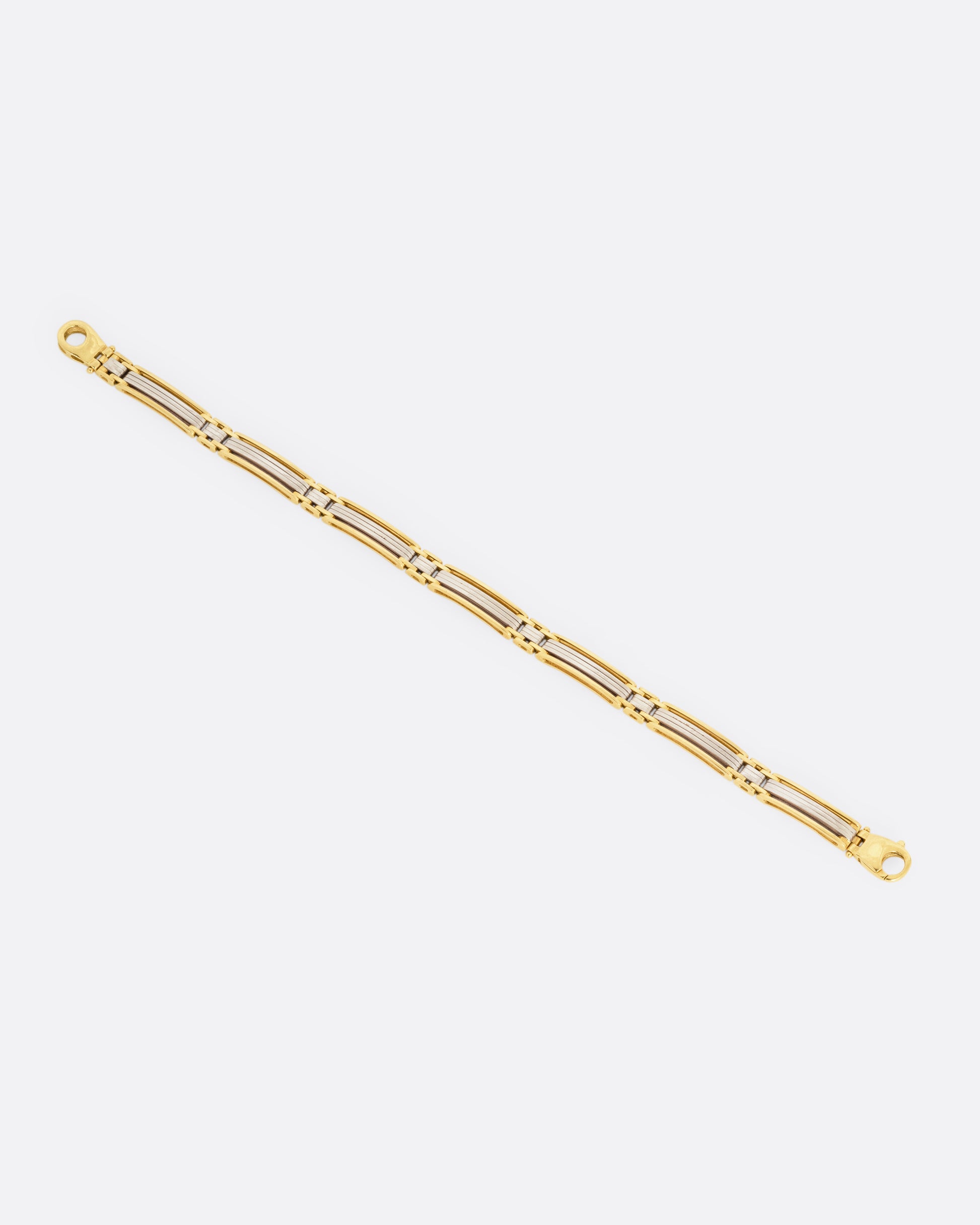 A yellow and white gold bracelet, shown from the front.
