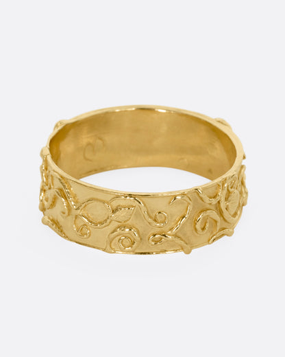 Yellow gold filigree band, angled view of the swirls and the inside of the band