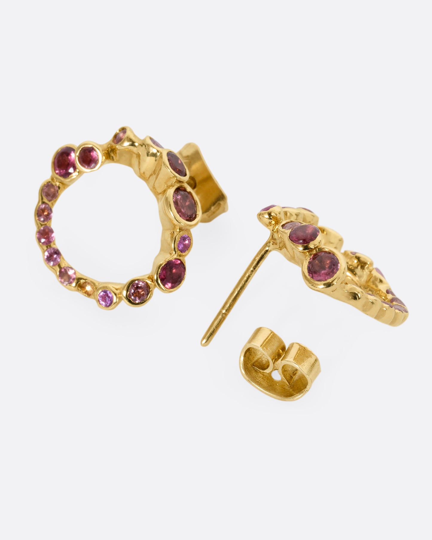 yellow gold earrings with pink and red tourmalines shown from the back