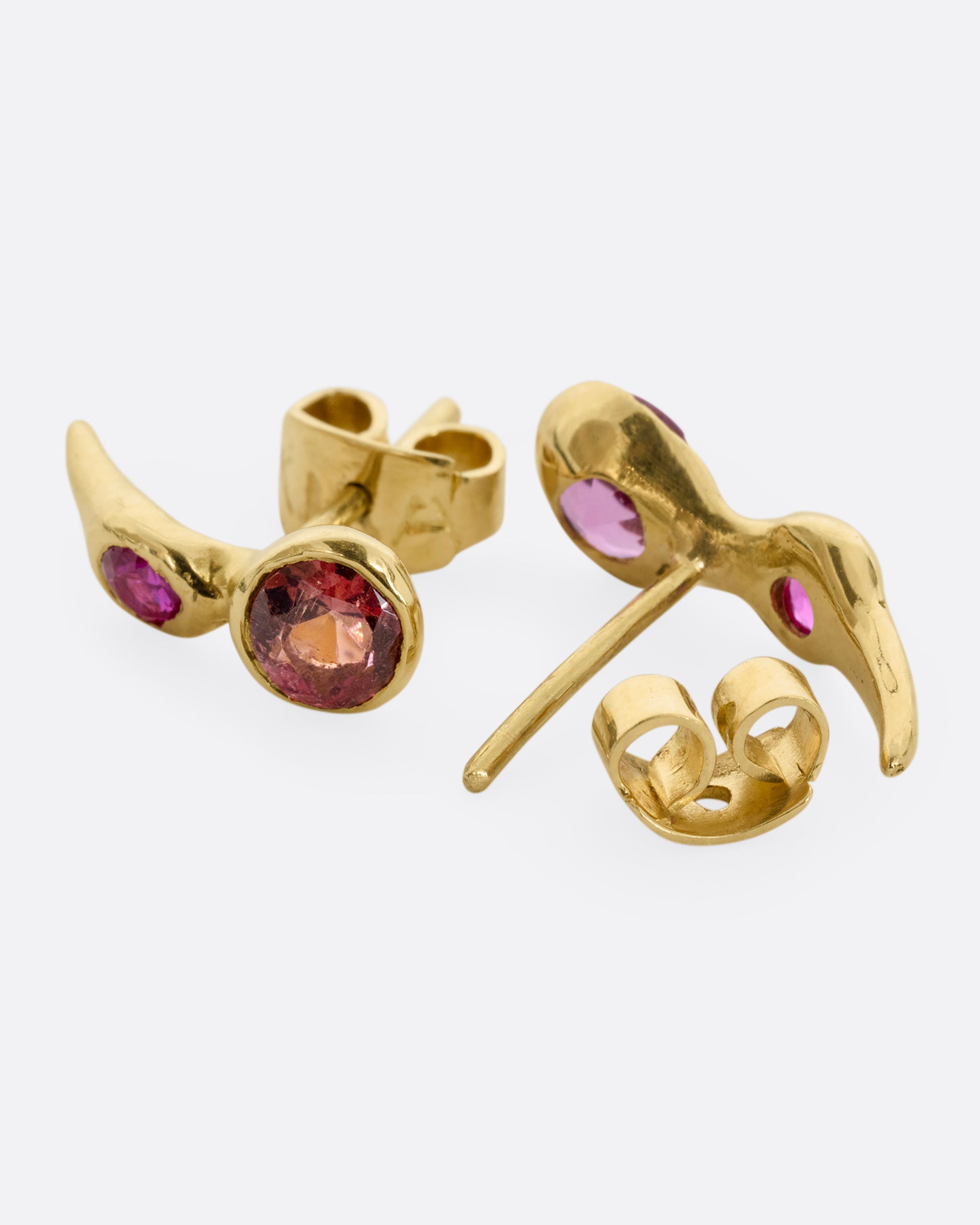 yellow gold earring with ruby and pink tourmalines shown from the back