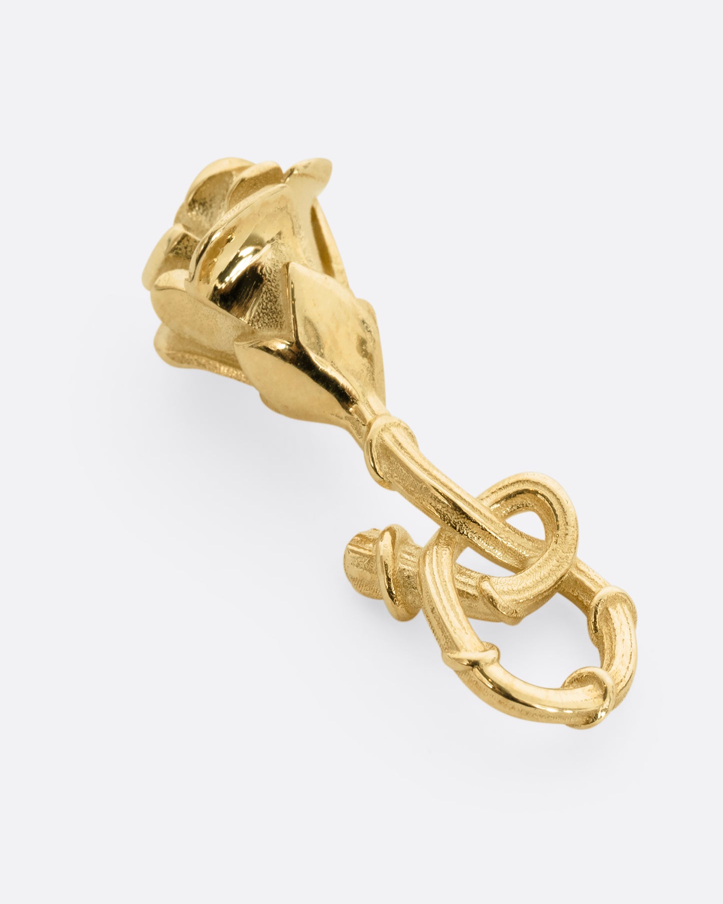 yellow gold rose charm with ruby, shown from the back
