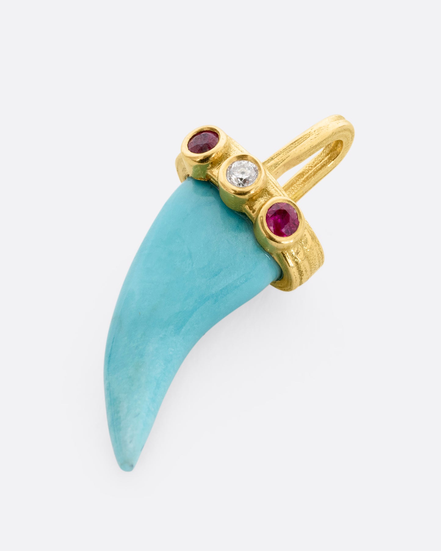 yellow gold tooth shaped turquoise charm shown lying flat